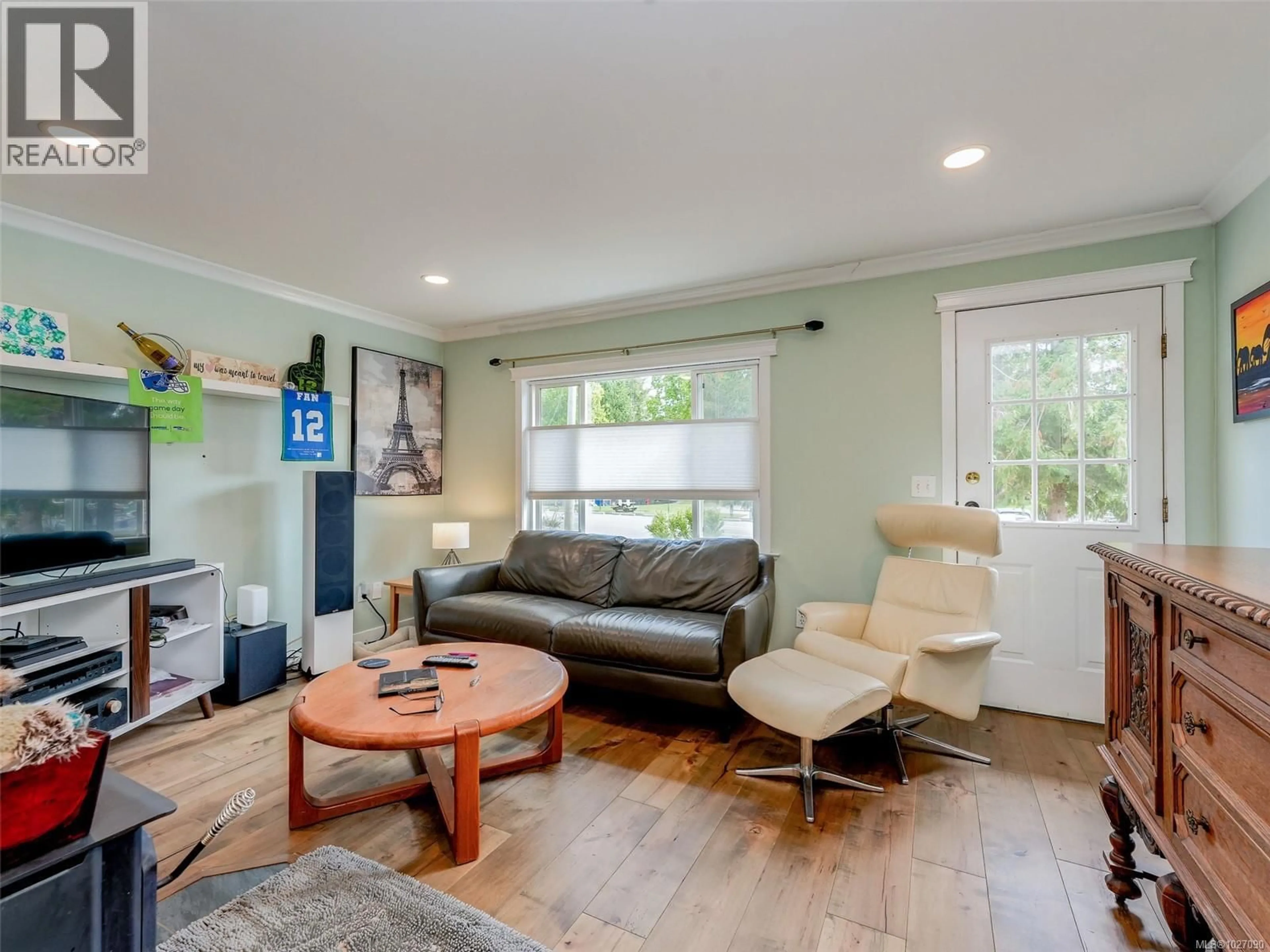 Living room with furniture, wood/laminate floor for 2818 CARLOW ROAD, Langford British Columbia V9B4E3