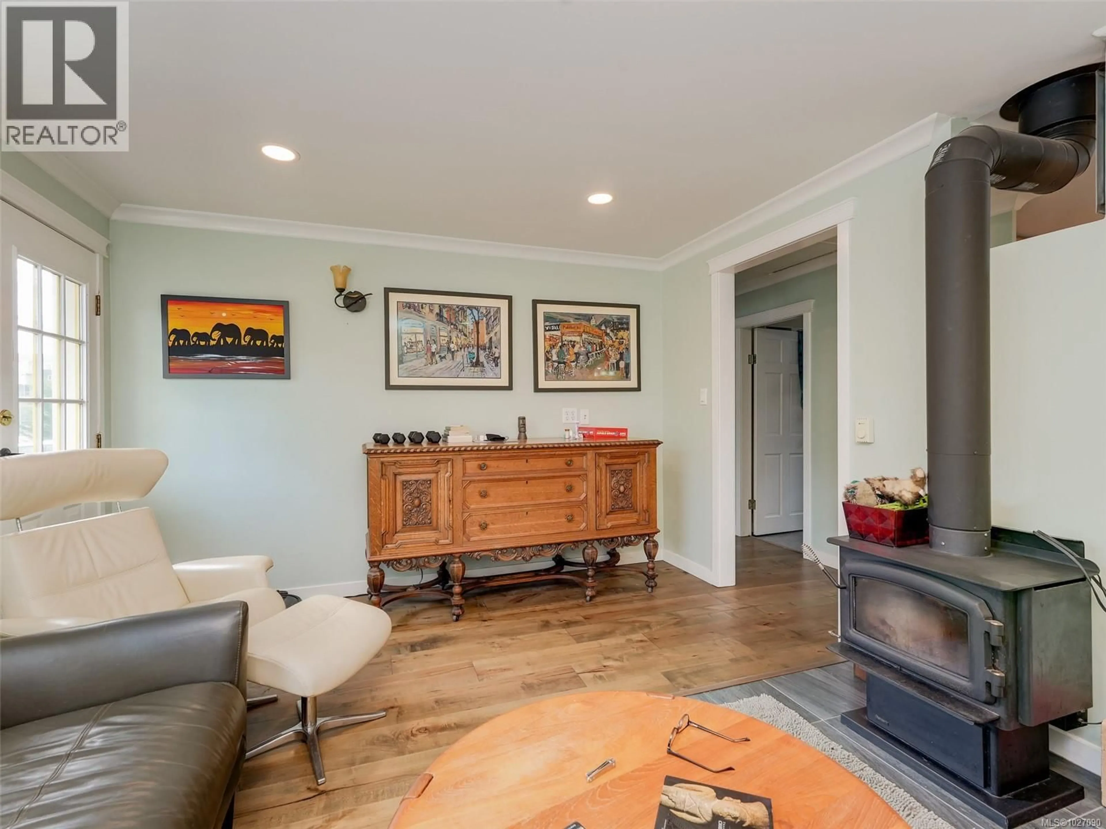 Living room with furniture, wood/laminate floor for 2818 CARLOW ROAD, Langford British Columbia V9B4E3