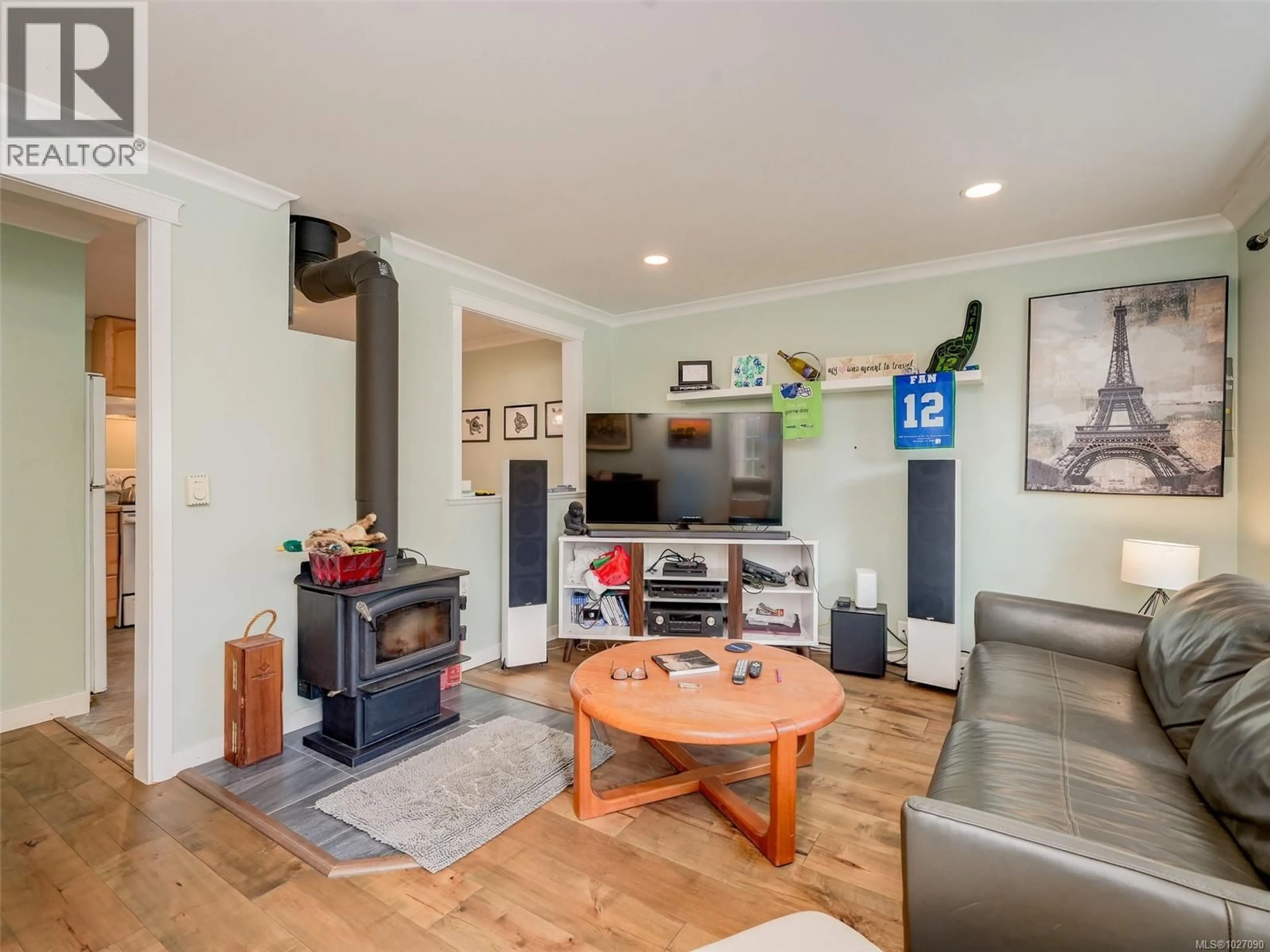 Living room with furniture, wood/laminate floor for 2818 CARLOW ROAD, Langford British Columbia V9B4E3
