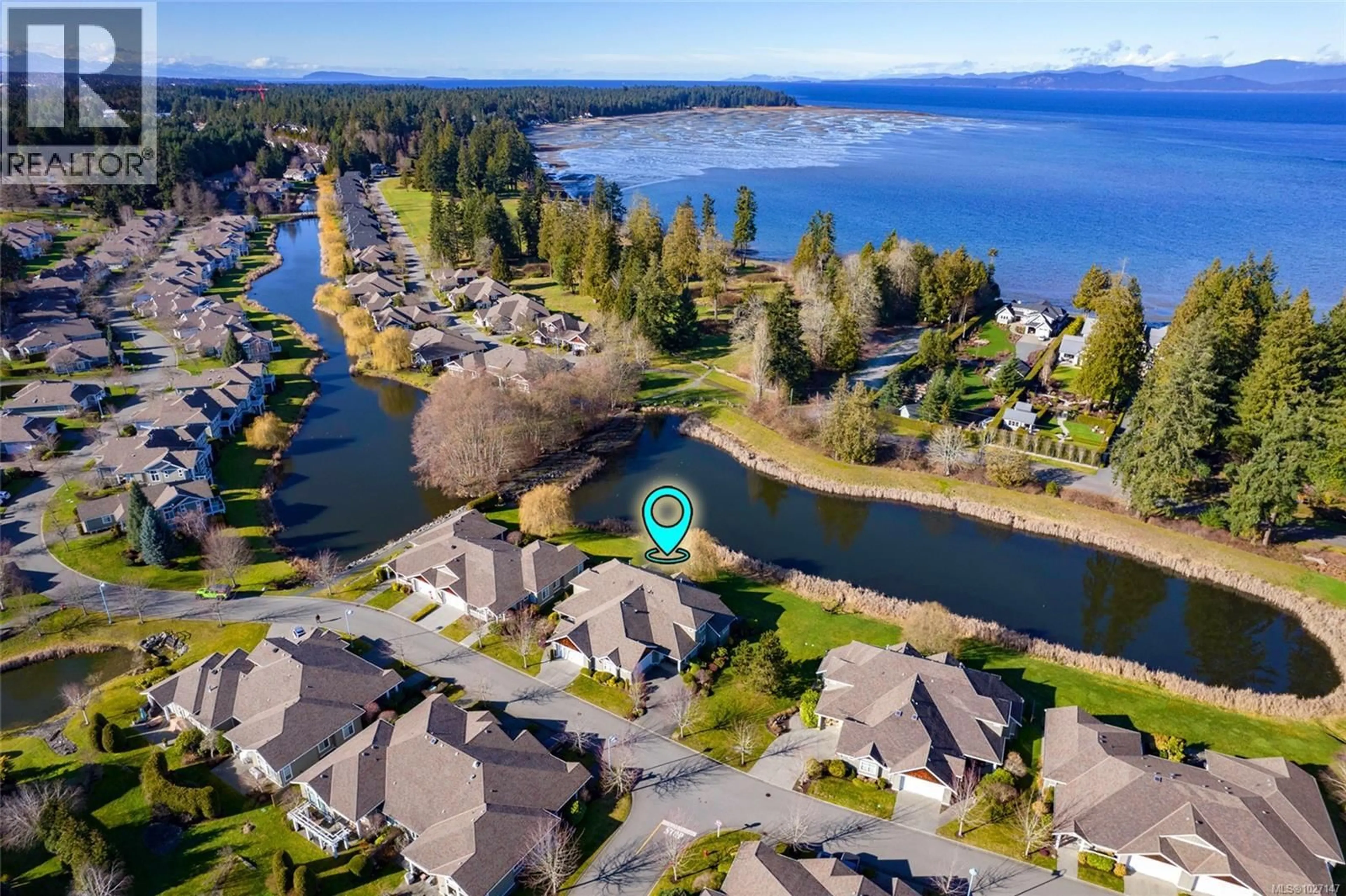 A pic from outside/outdoor area/front of a property/back of a property/a pic from drone, water/lake/river/ocean view for 1413 SATURNA DRIVE, Parksville British Columbia V9P2Y1