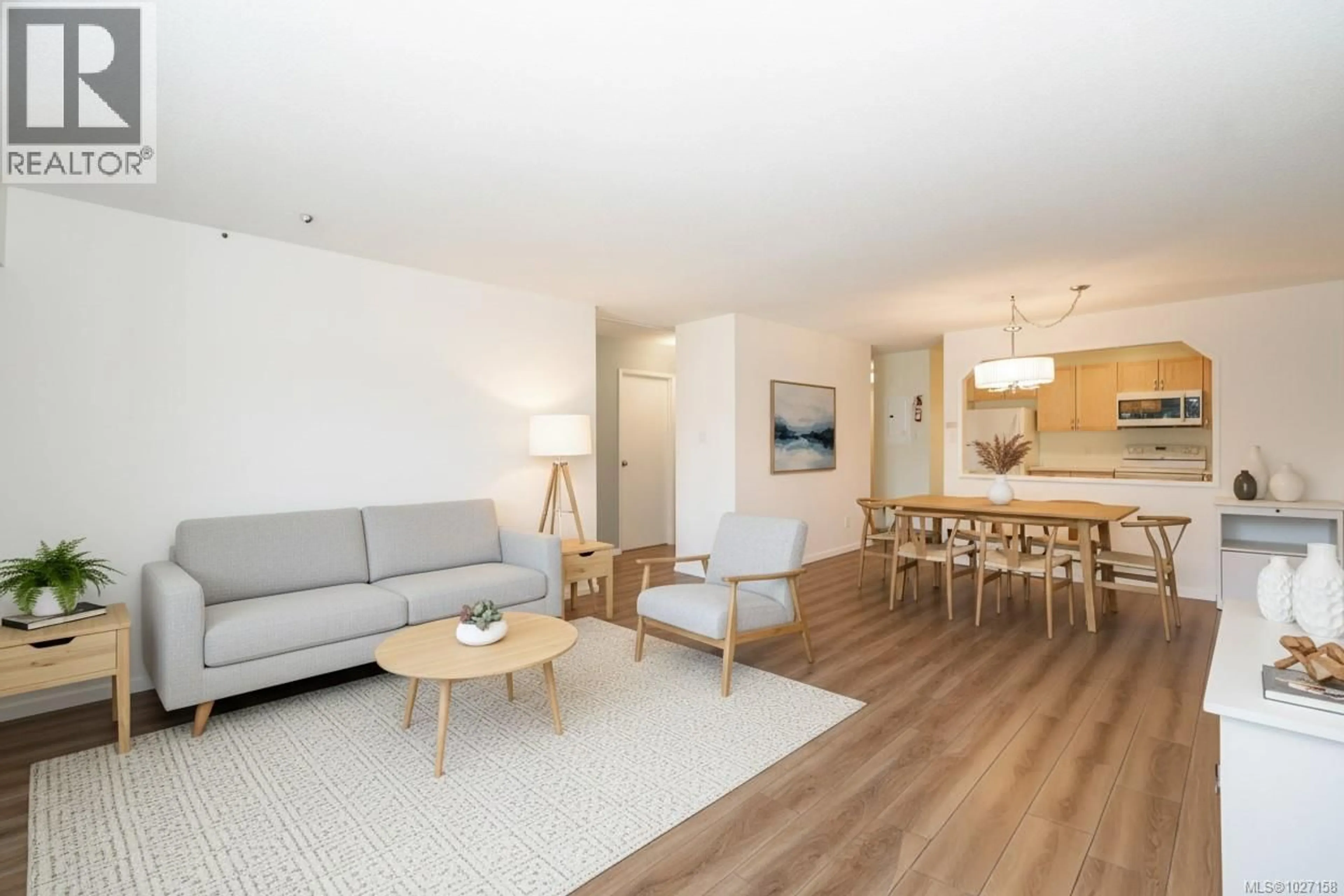 Living room with furniture, wood/laminate floor for 401 - 1188 YATES STREET, Victoria British Columbia V8V3M8