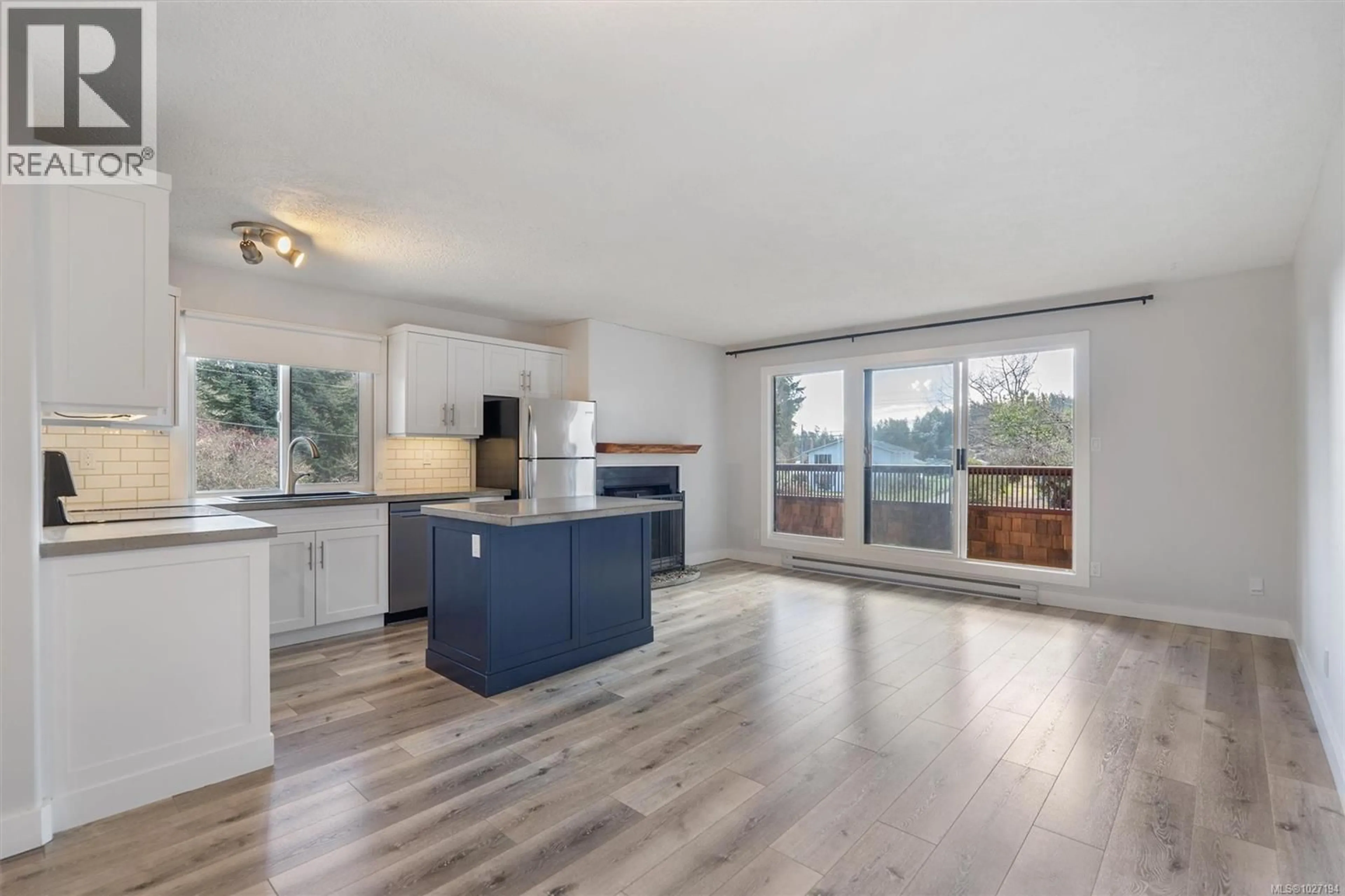 Open concept kitchen, wood/laminate floor for 12 - 1956 GLENIDLE ROAD, Sooke British Columbia V0S1N0