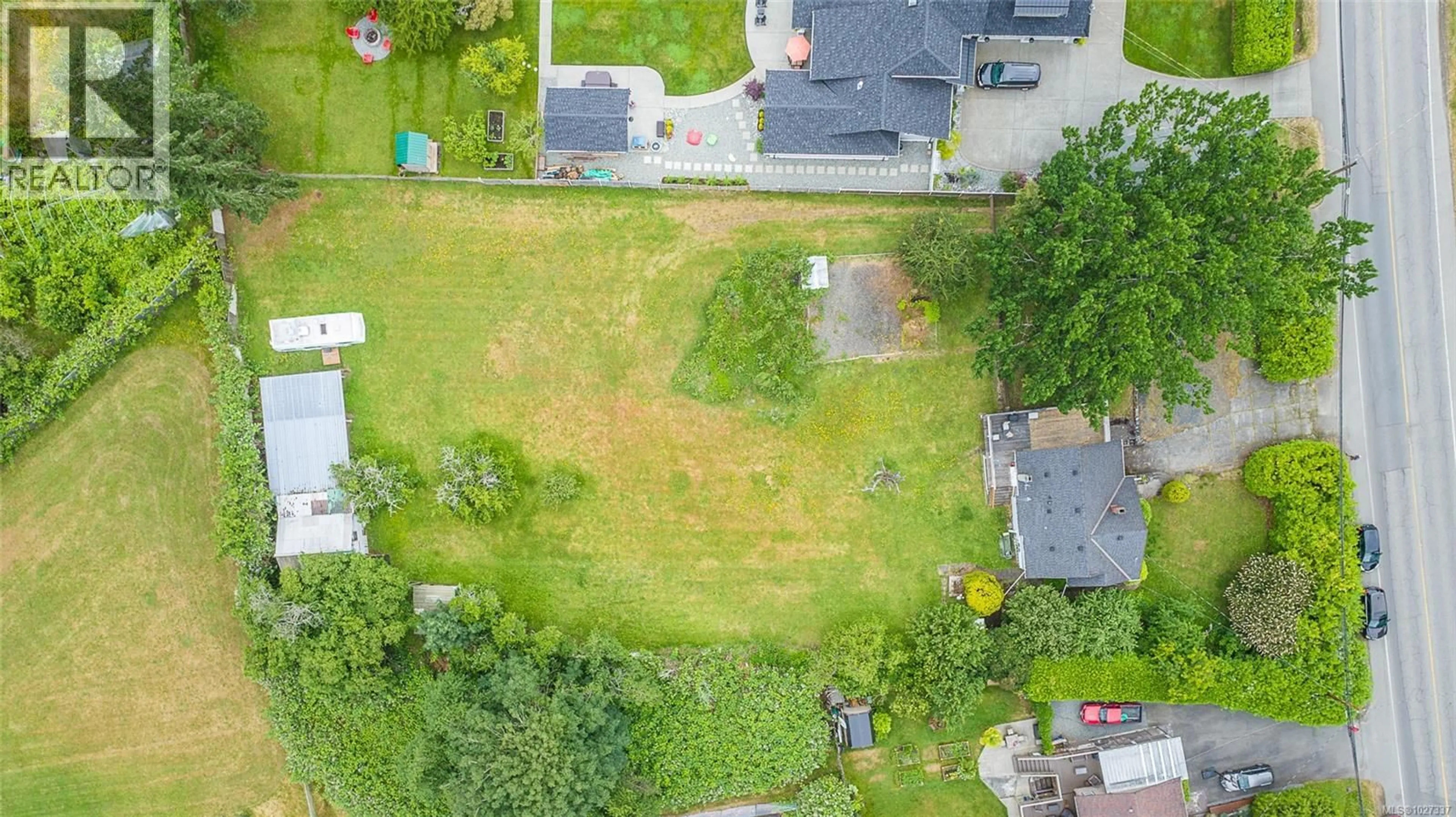 A pic from outside/outdoor area/front of a property/back of a property/a pic from drone, street for 7261 LANTZVILLE ROAD, Lantzville British Columbia V0R2H0