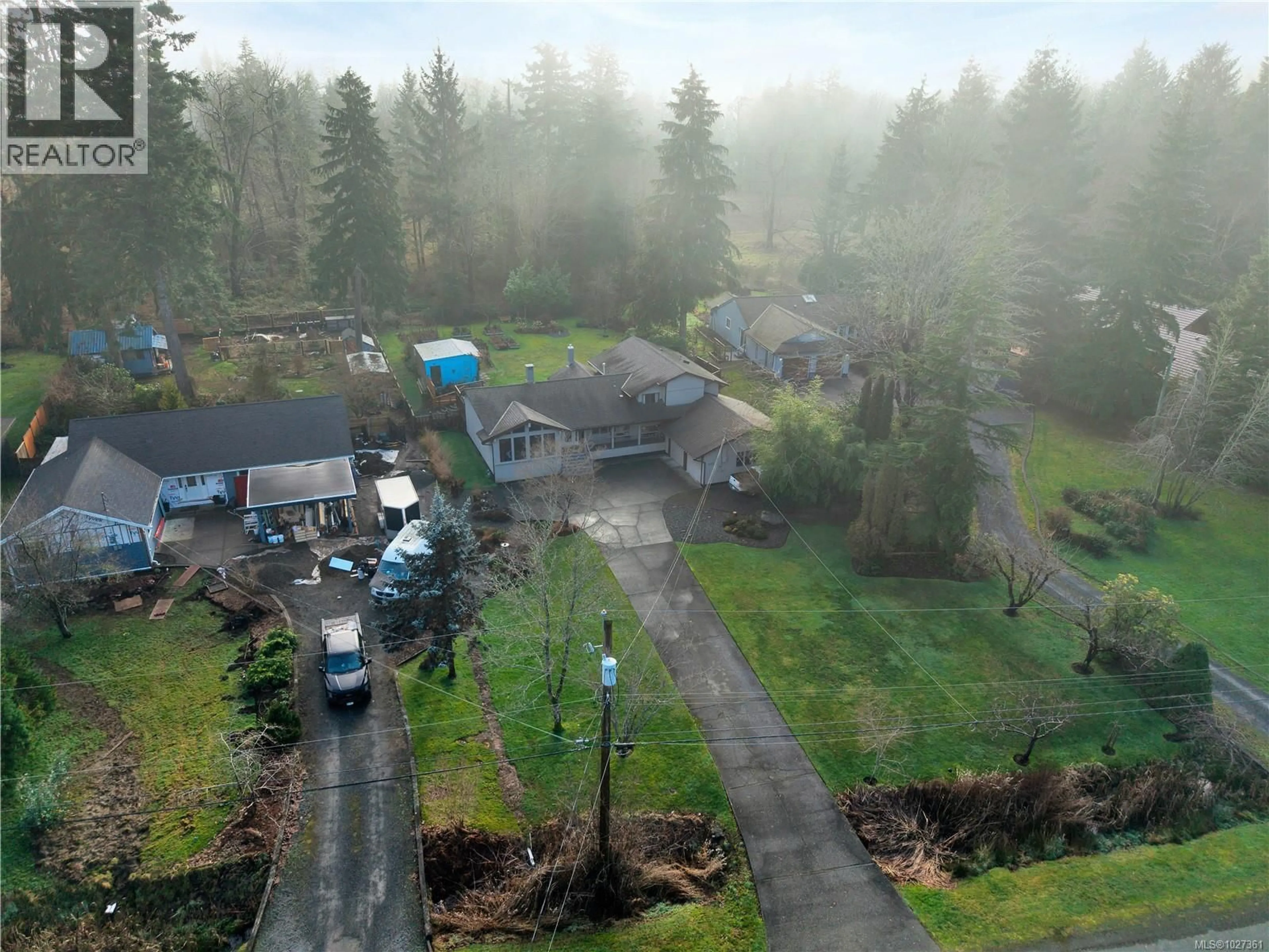 A pic from outside/outdoor area/front of a property/back of a property/a pic from drone, mountain view for 103 REDONDA WAY, Campbell River British Columbia V9H1J4
