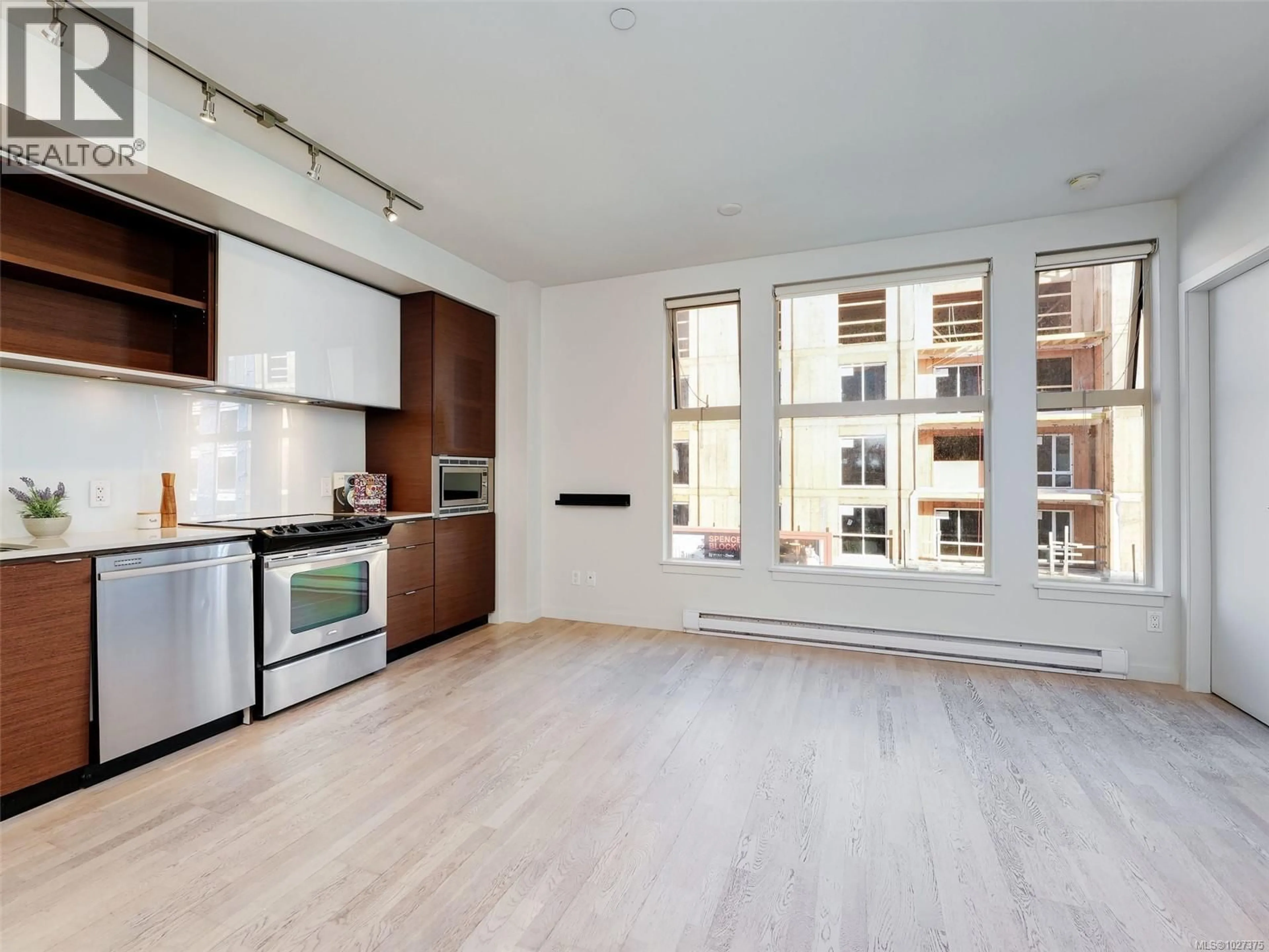 Open concept kitchen, wood/laminate floor for 309 - 601 HERALD STREET, Victoria British Columbia V8W1S8