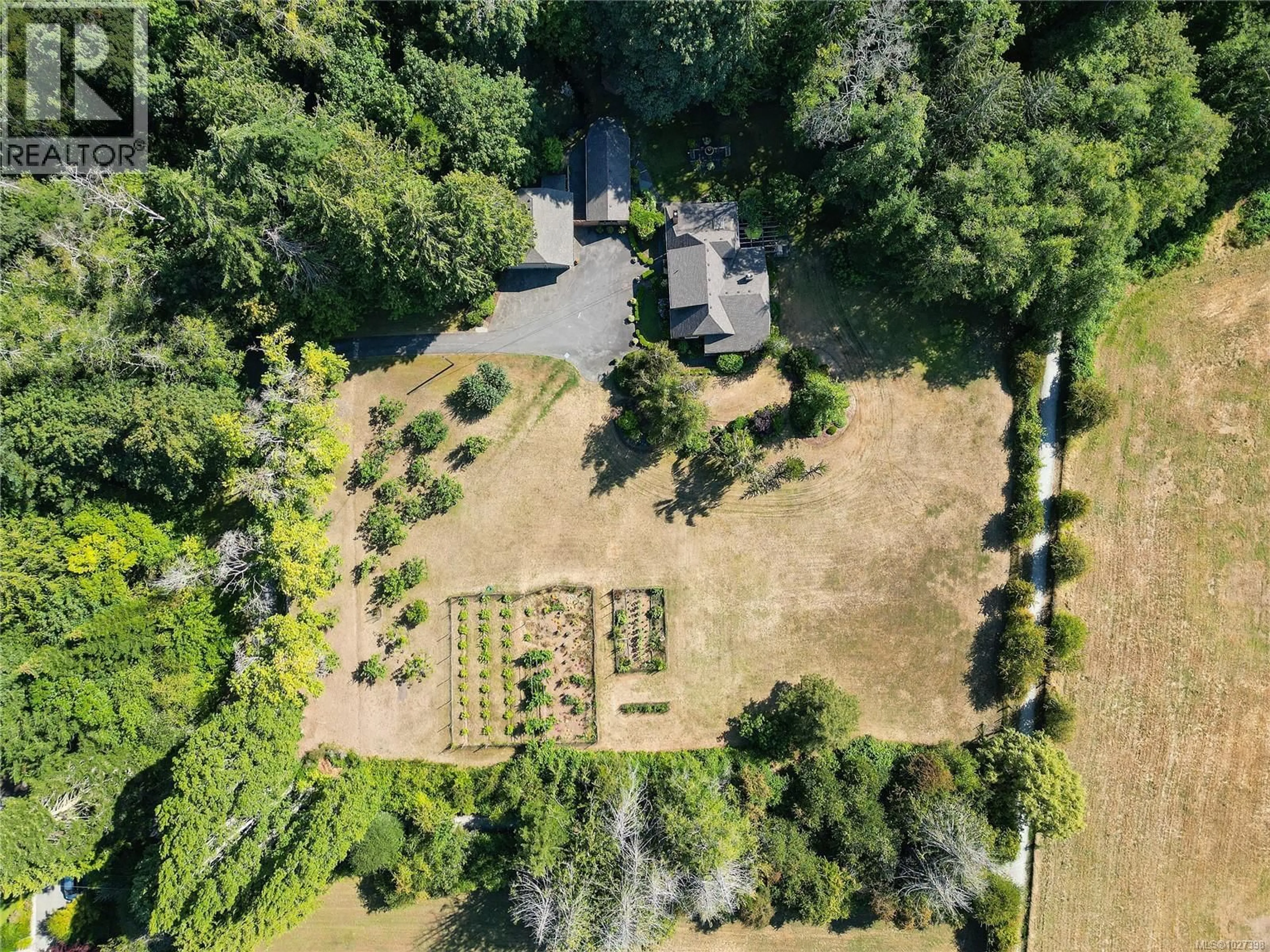 A pic from outside/outdoor area/front of a property/back of a property/a pic from drone, forest/trees view for 1695 CULTRA AVENUE, Central Saanich British Columbia V8M1T1