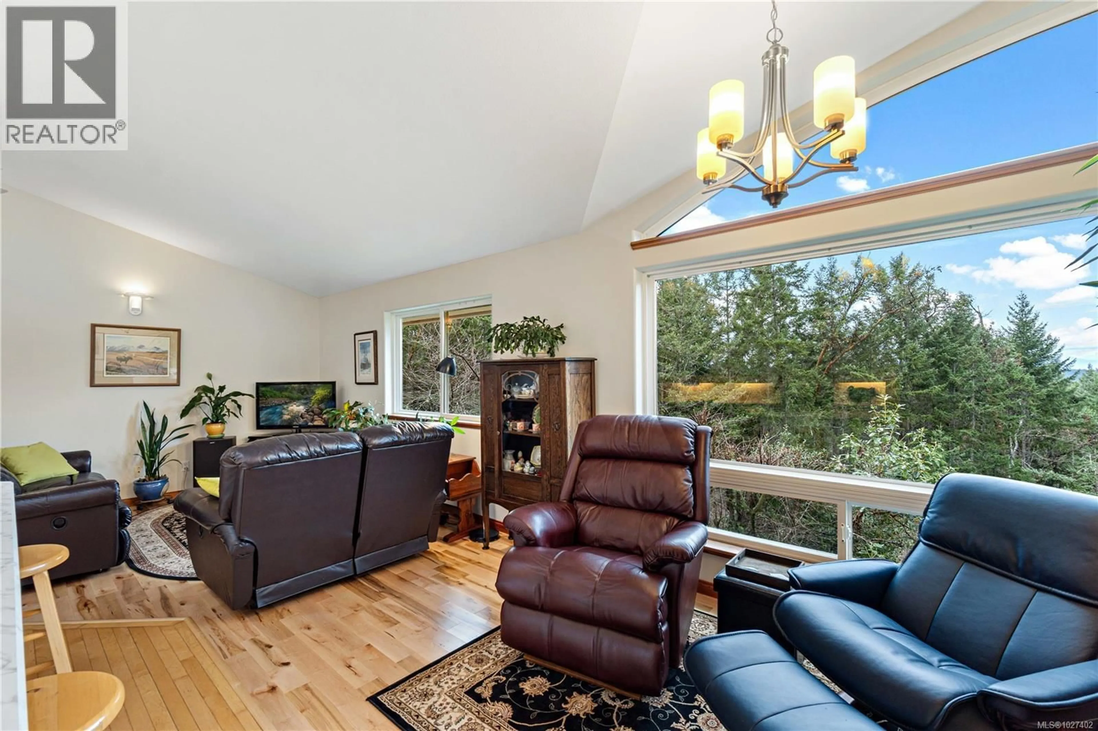 Living room with furniture, wood/laminate floor for 1990 RENA ROAD, Nanoose Bay British Columbia V9P9B1