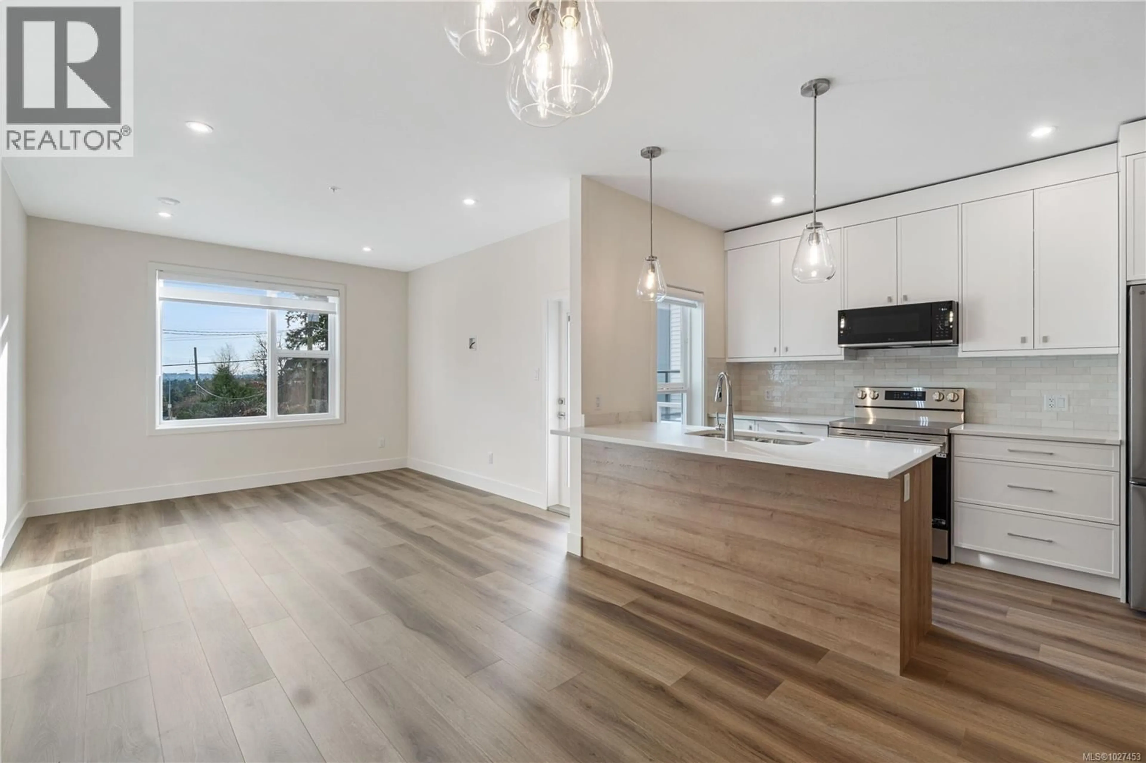 Open concept kitchen, wood/laminate floor for 1519 MARBAN ROAD, Nanaimo British Columbia V9X1A1