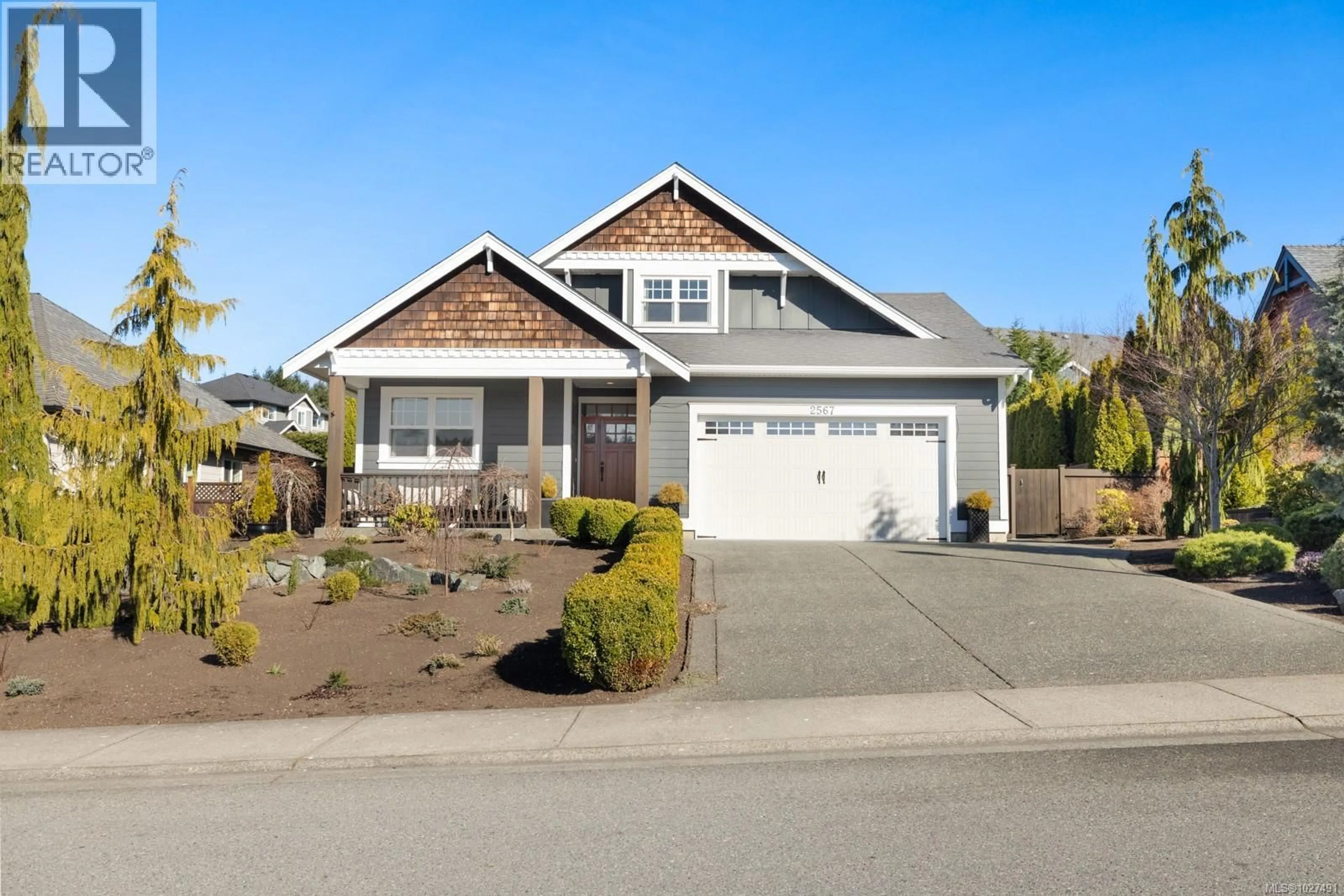 Home with vinyl exterior material, street for 2567 MCCLAREN ROAD, Mill Bay British Columbia V0R2P1