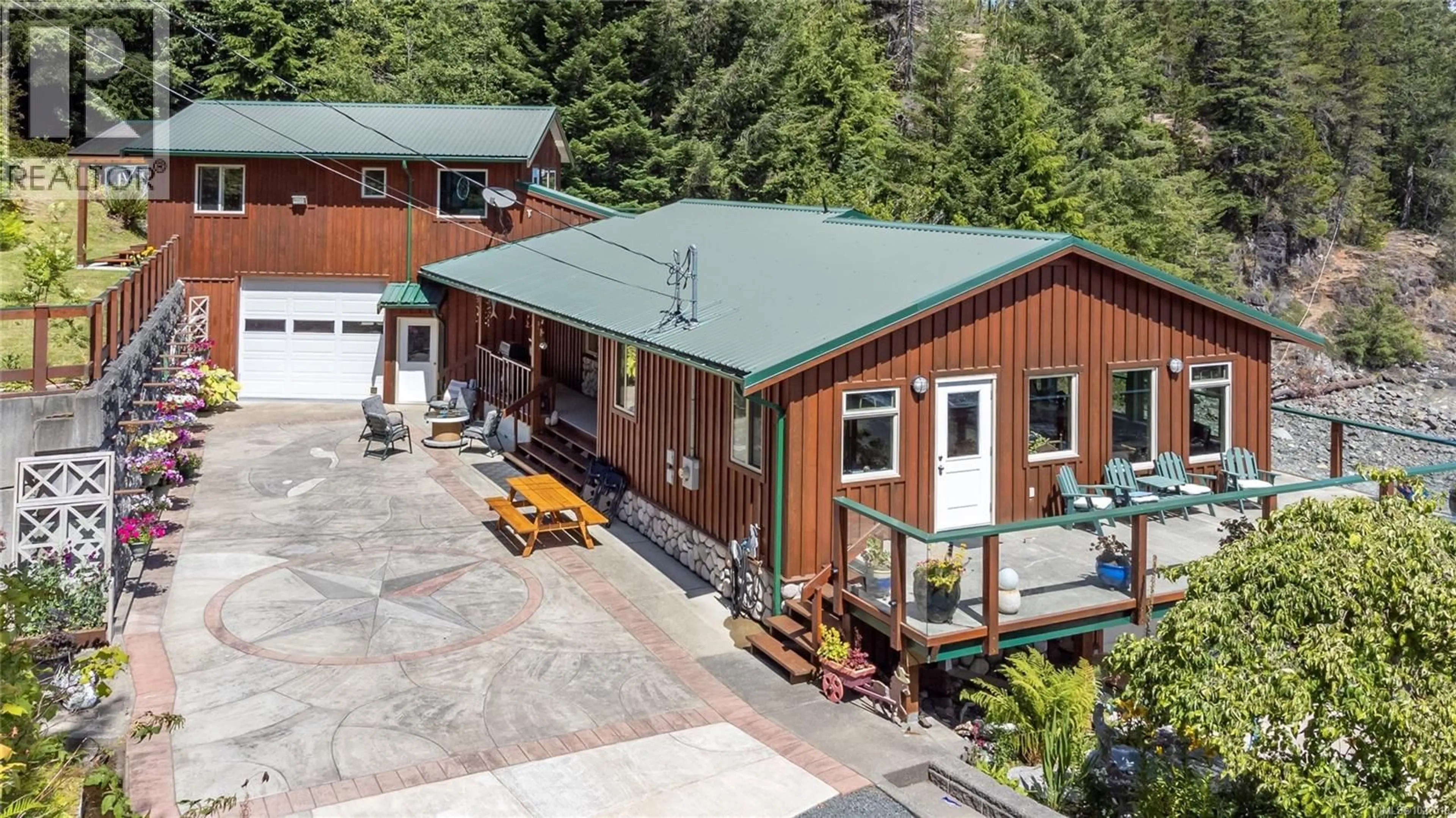 A pic from outside/outdoor area/front of a property/back of a property/a pic from drone, unknown for 23 SAYWARD ROAD, Sayward British Columbia V0P1R0
