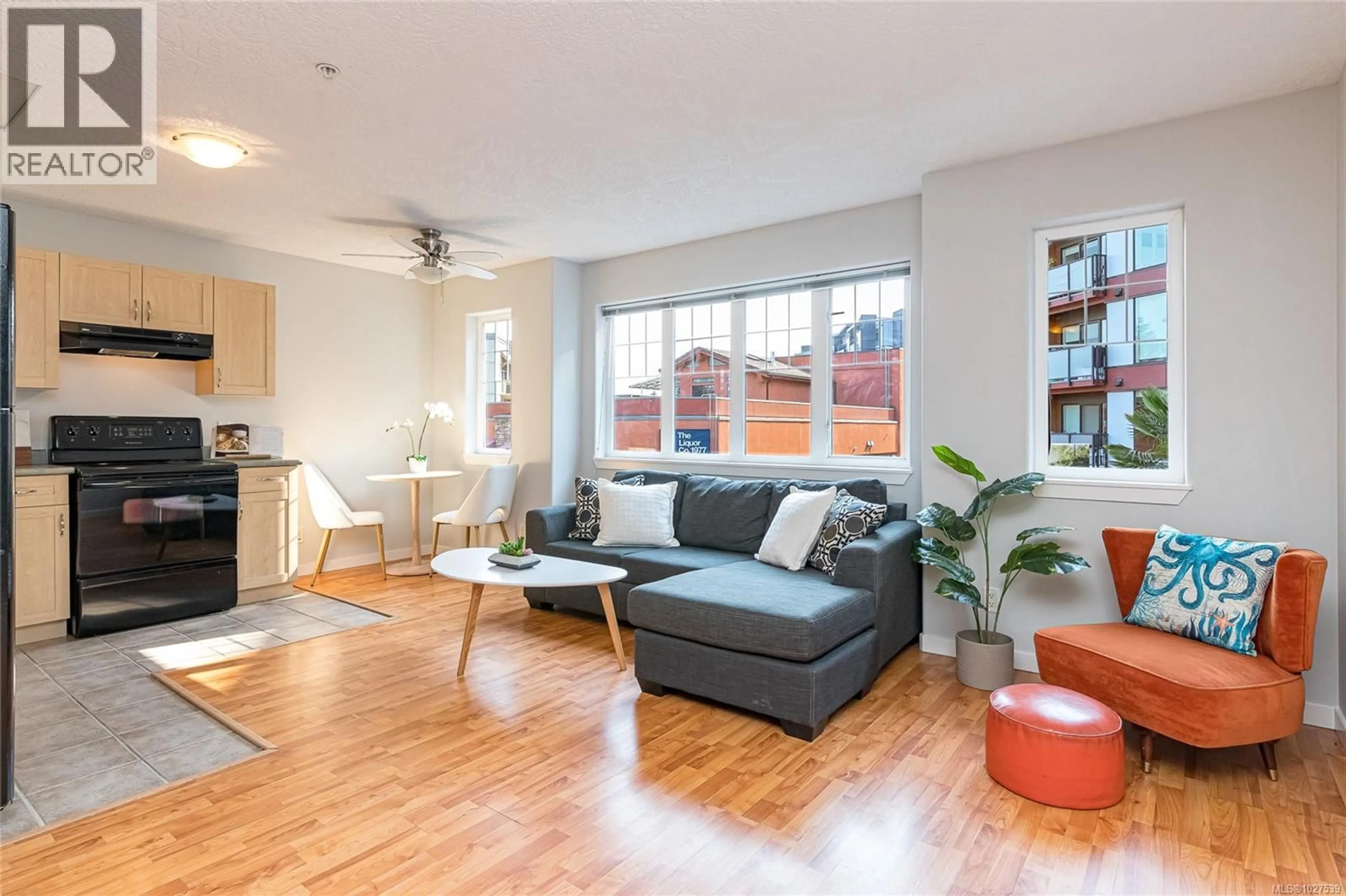Living room with furniture, wood/laminate floor for 203 - 2844 BRYN MAUR ROAD, Langford British Columbia V9B3T4