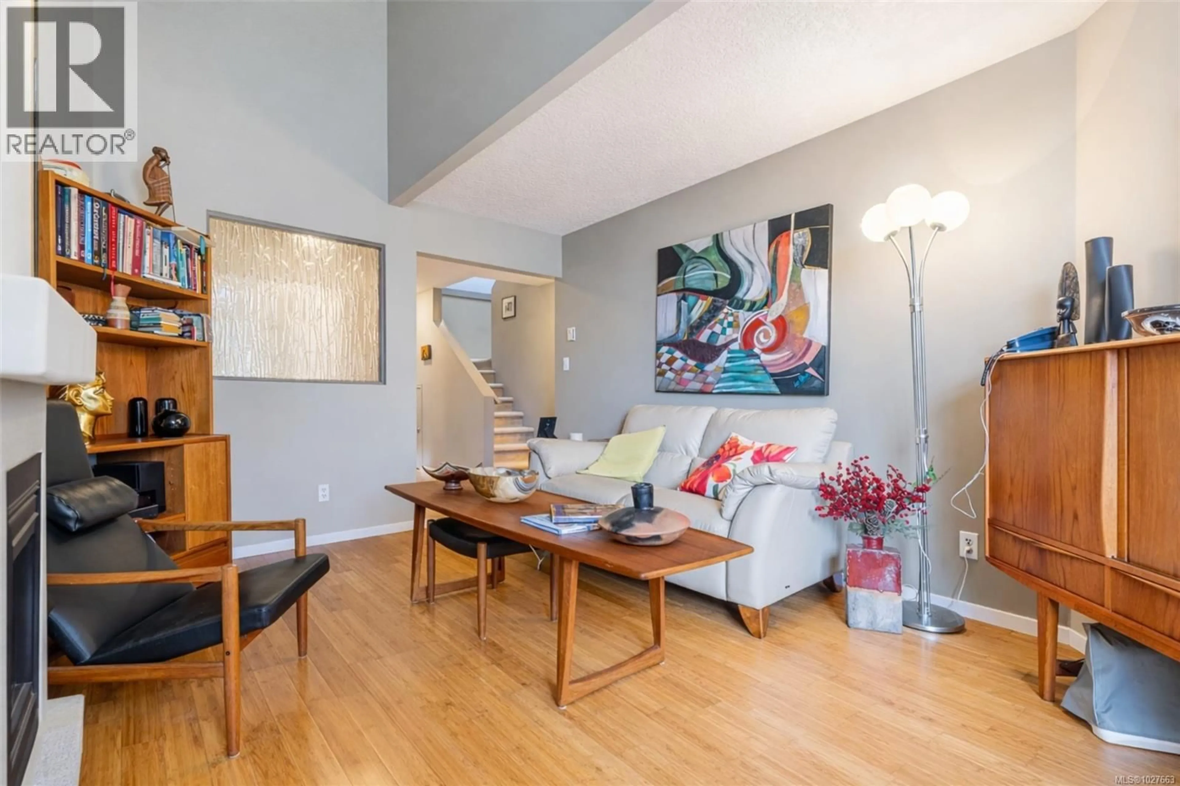 Living room with furniture, wood/laminate floor for 1771 BAY STREET, Victoria British Columbia V8R2B9