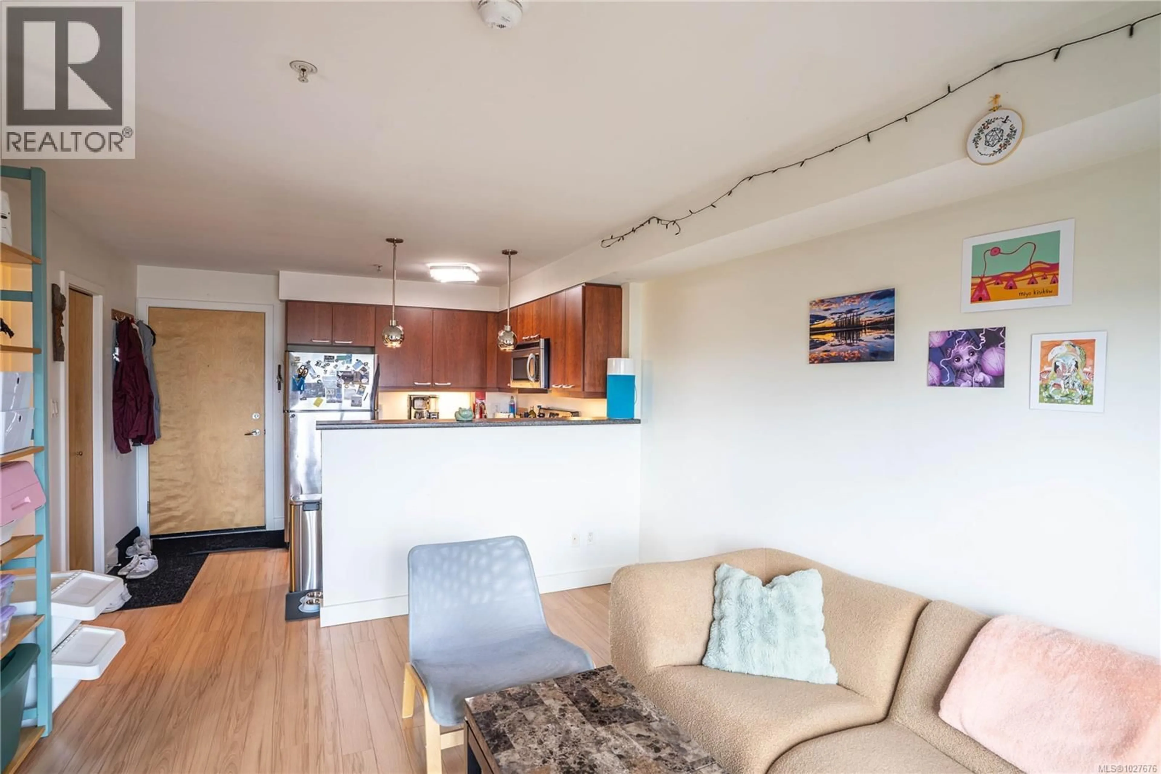 Living room with furniture, wood/laminate floor for 407 - 356 GORGE ROAD EAST, Victoria British Columbia V8T2W2