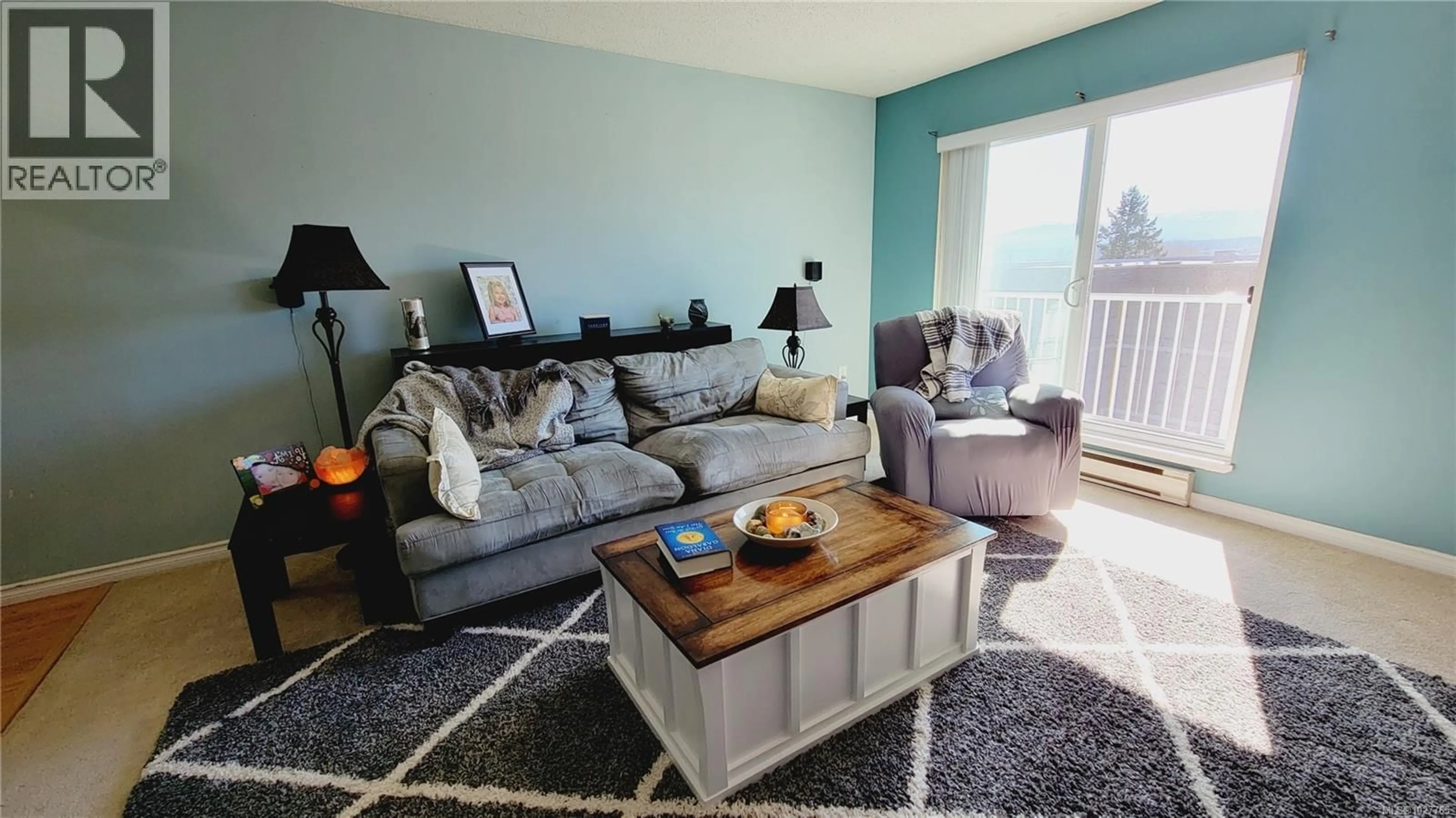 Living room with furniture, wood/laminate floor for 401 - 175 CENTENNIAL DRIVE, Courtenay British Columbia V9N7M4