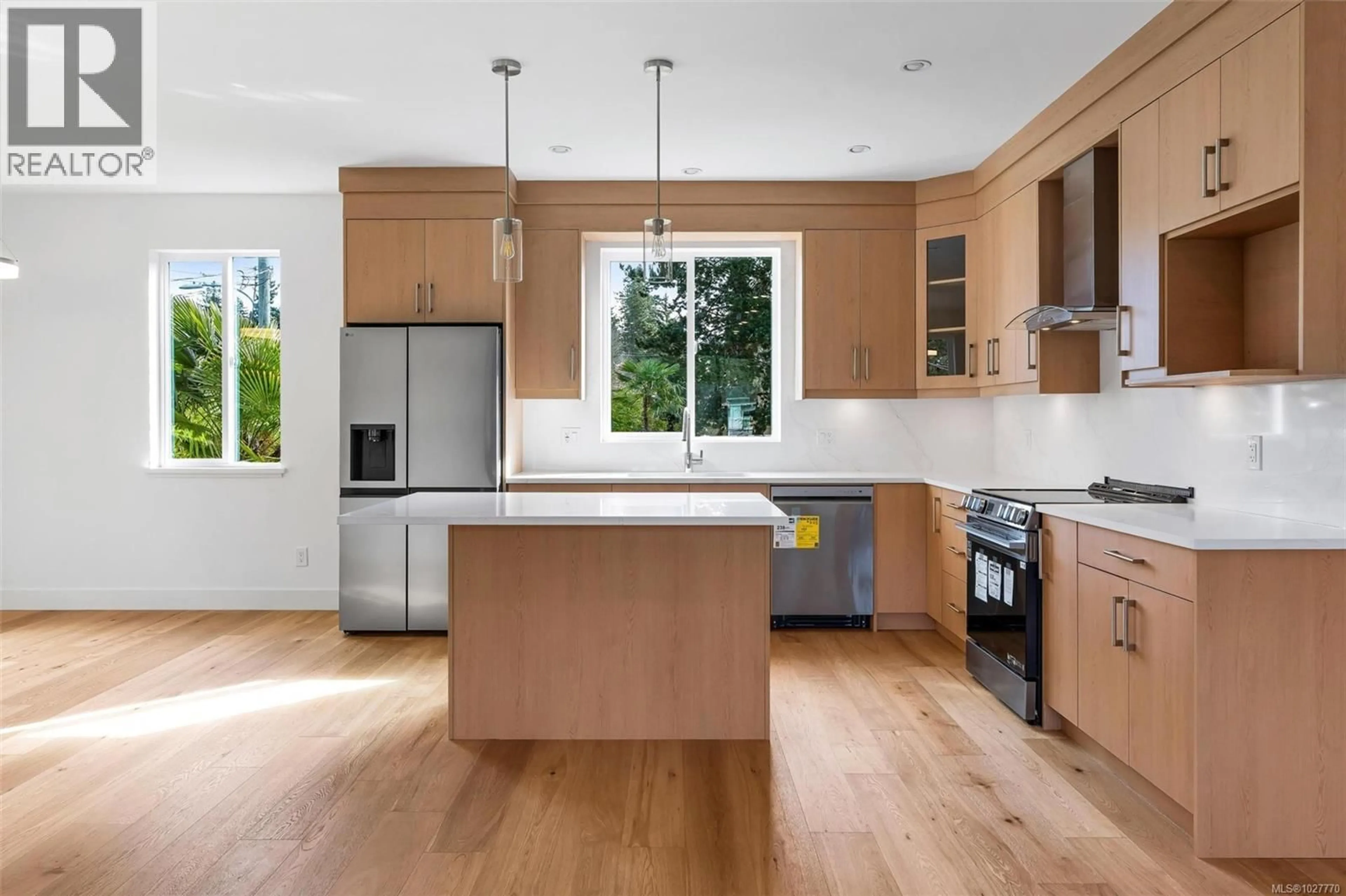 Contemporary kitchen, wood/laminate floor for 1 - 1559 ASH ROAD, Saanich British Columbia V8N2S9