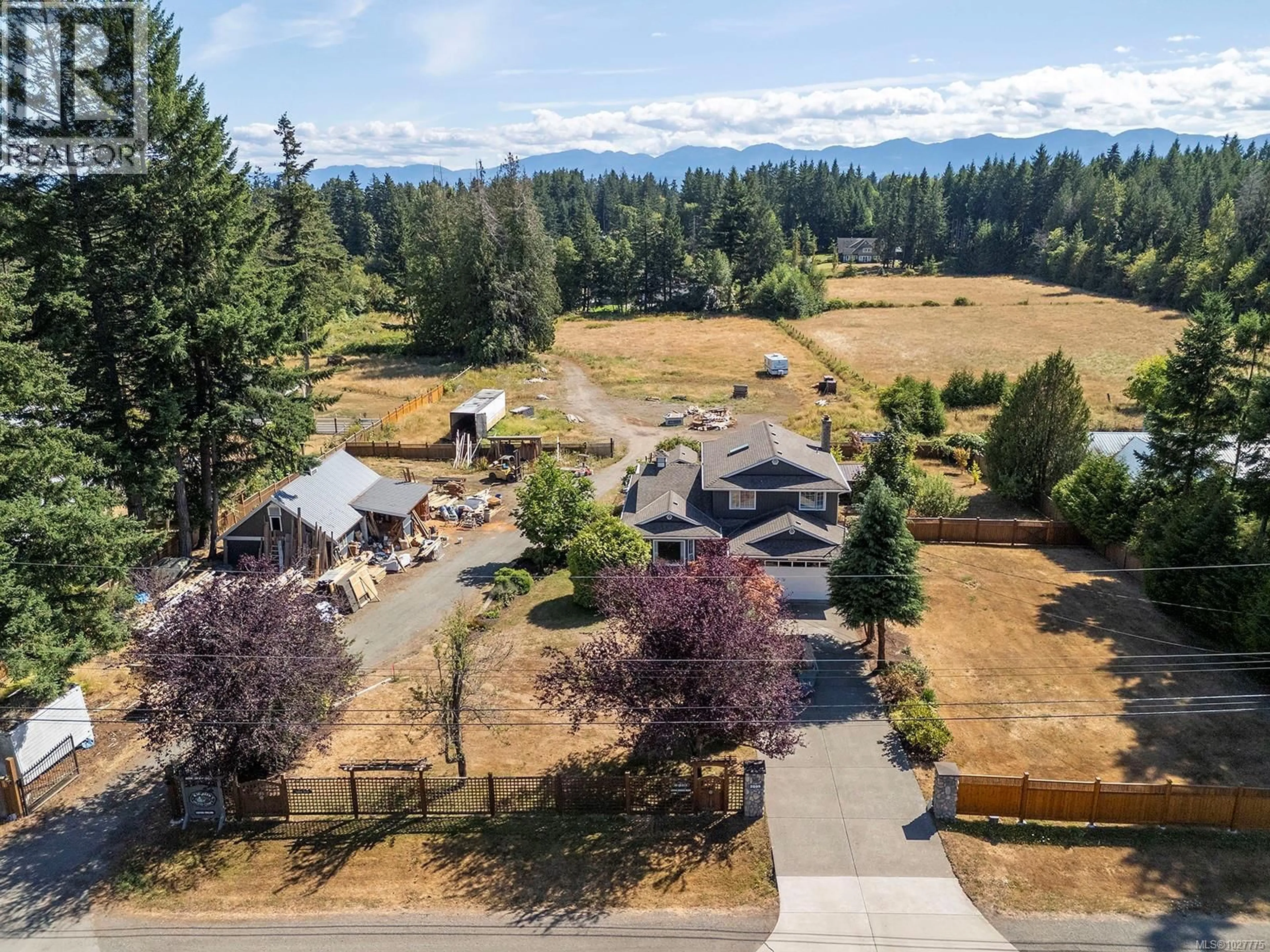 A pic from outside/outdoor area/front of a property/back of a property/a pic from drone, mountain view for 2099 IDIENS WAY, Comox British Columbia V9M3Y9
