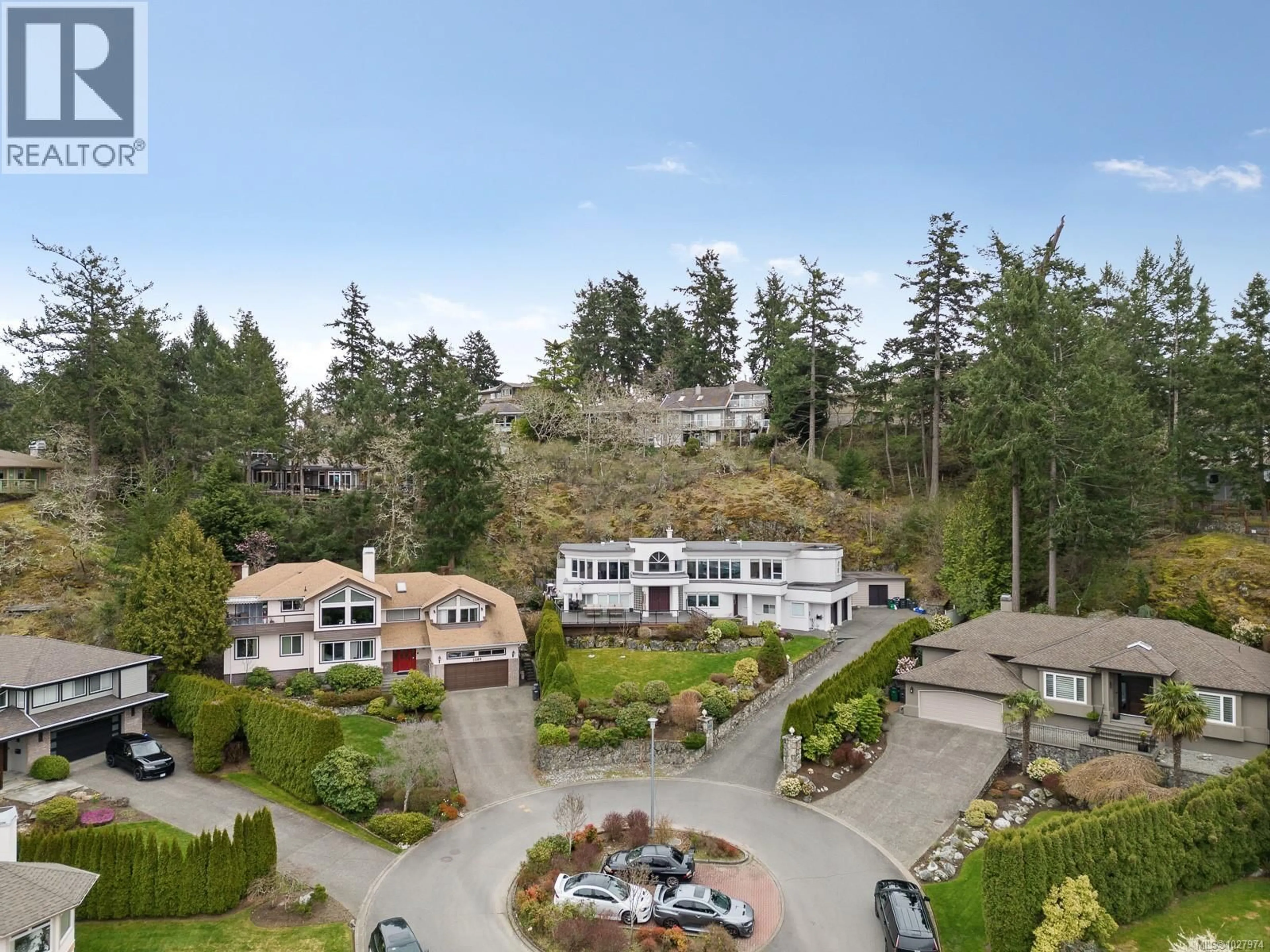 A pic from outside/outdoor area/front of a property/back of a property/a pic from drone, mountain view for 1087 TOTEMWOOD LANE, Saanich British Columbia V8X5E3