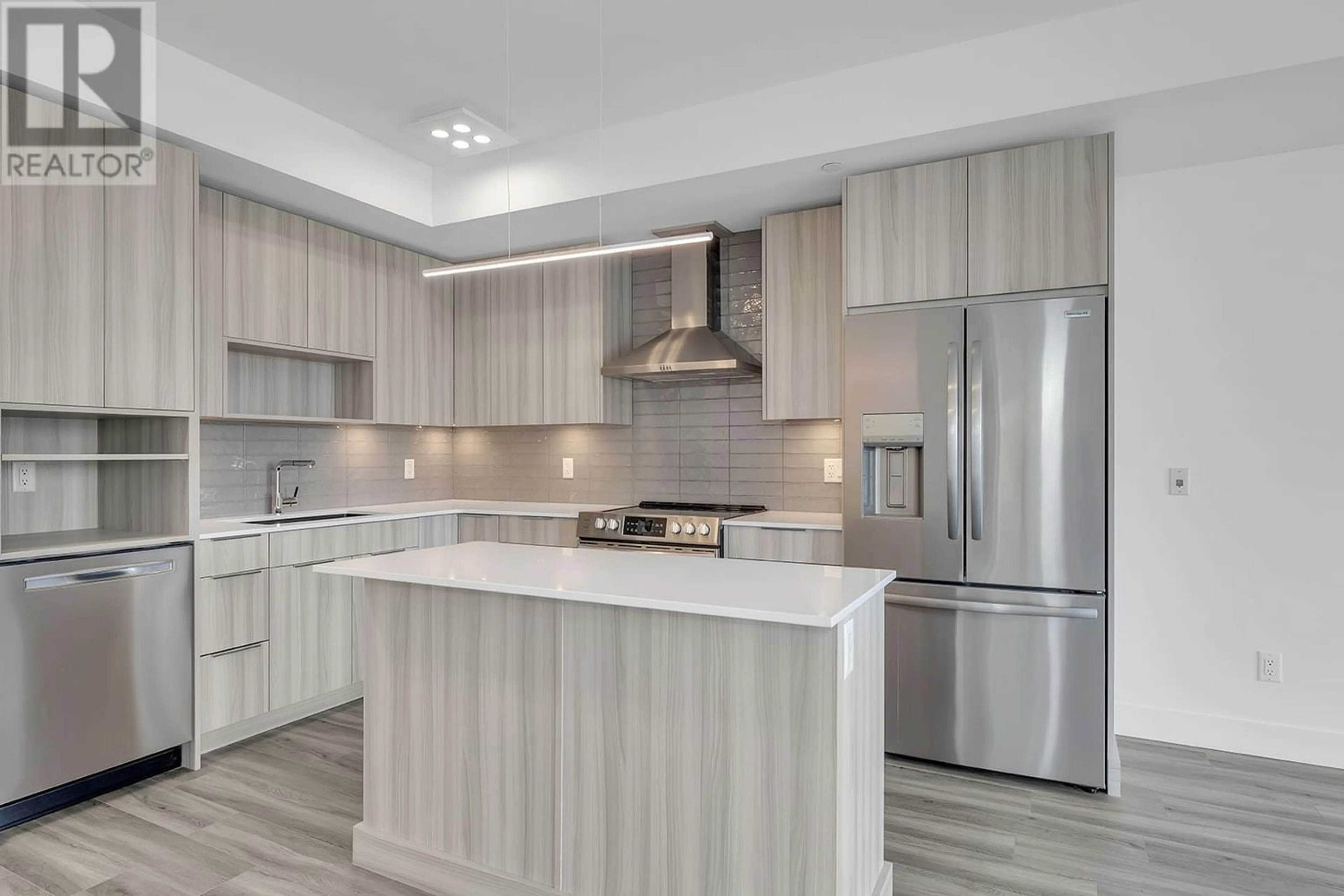 Open concept kitchen for 3642 Mission Springs Drive Unit# 502C, Kelowna British Columbia V1W0E1