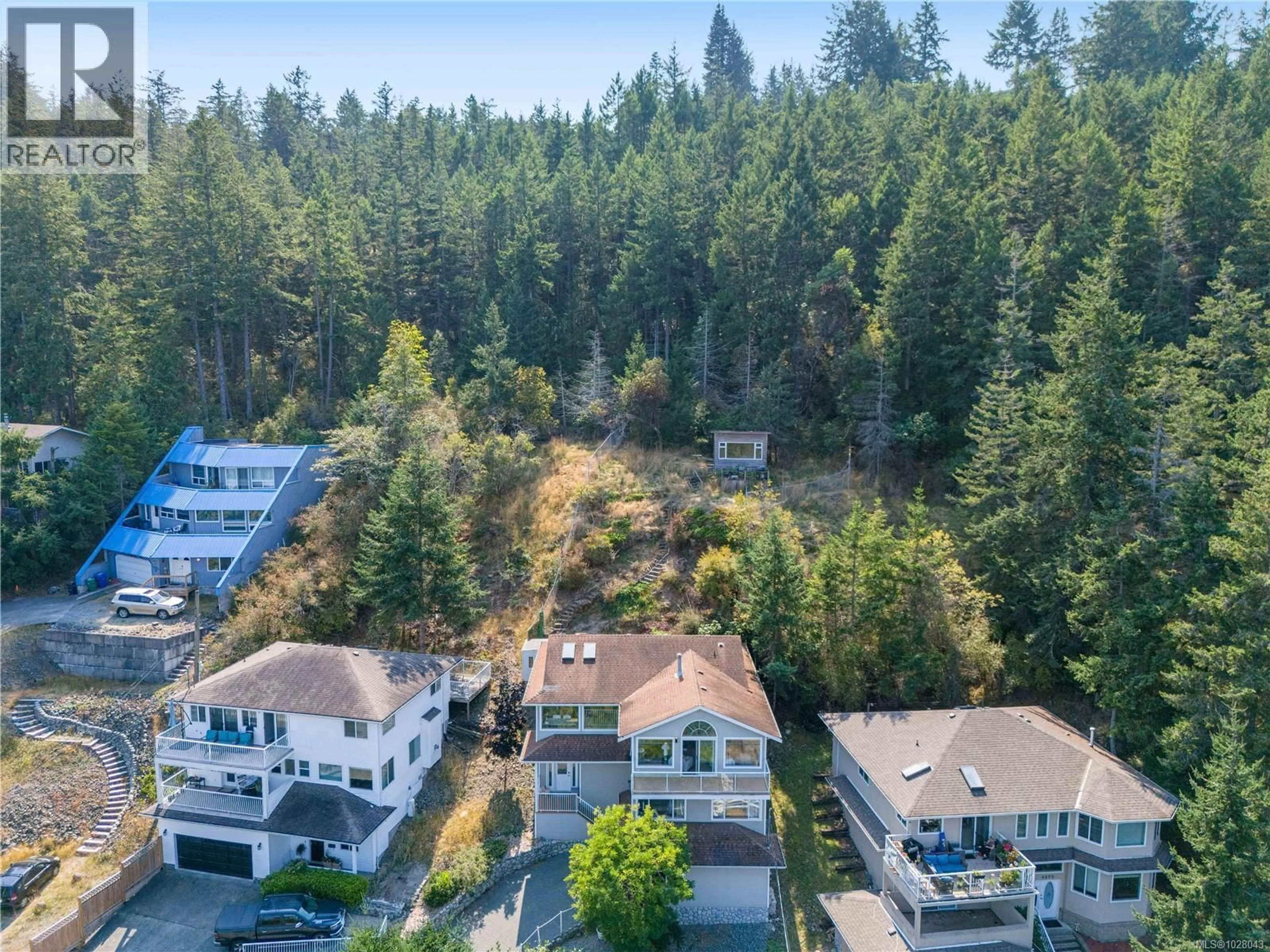A pic from outside/outdoor area/front of a property/back of a property/a pic from drone, forest/trees view for 4895 LAGUNA WAY, Nanaimo British Columbia V9T5C2