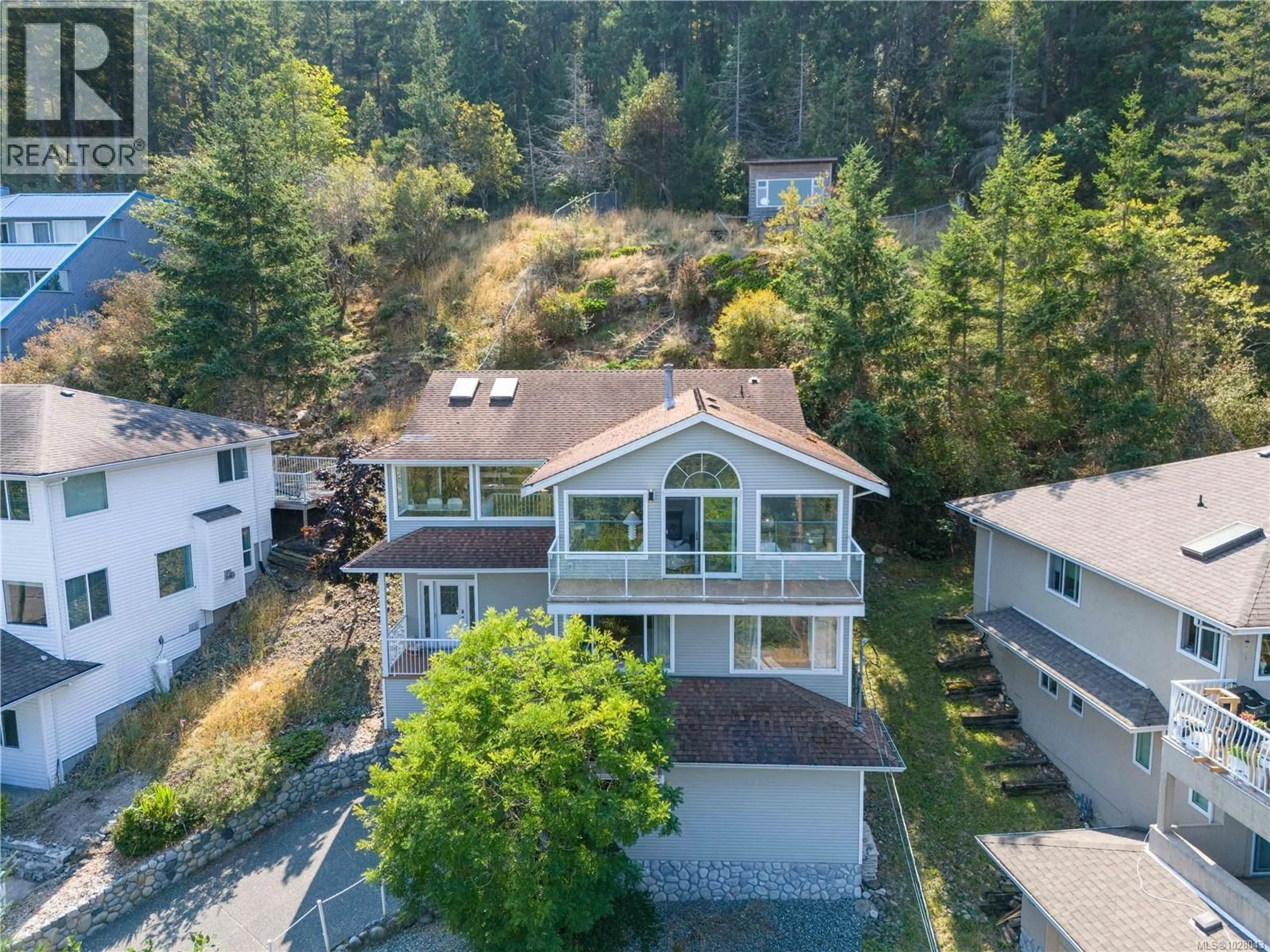 A pic from outside/outdoor area/front of a property/back of a property/a pic from drone, unknown for 4895 LAGUNA WAY, Nanaimo British Columbia V9T5C2