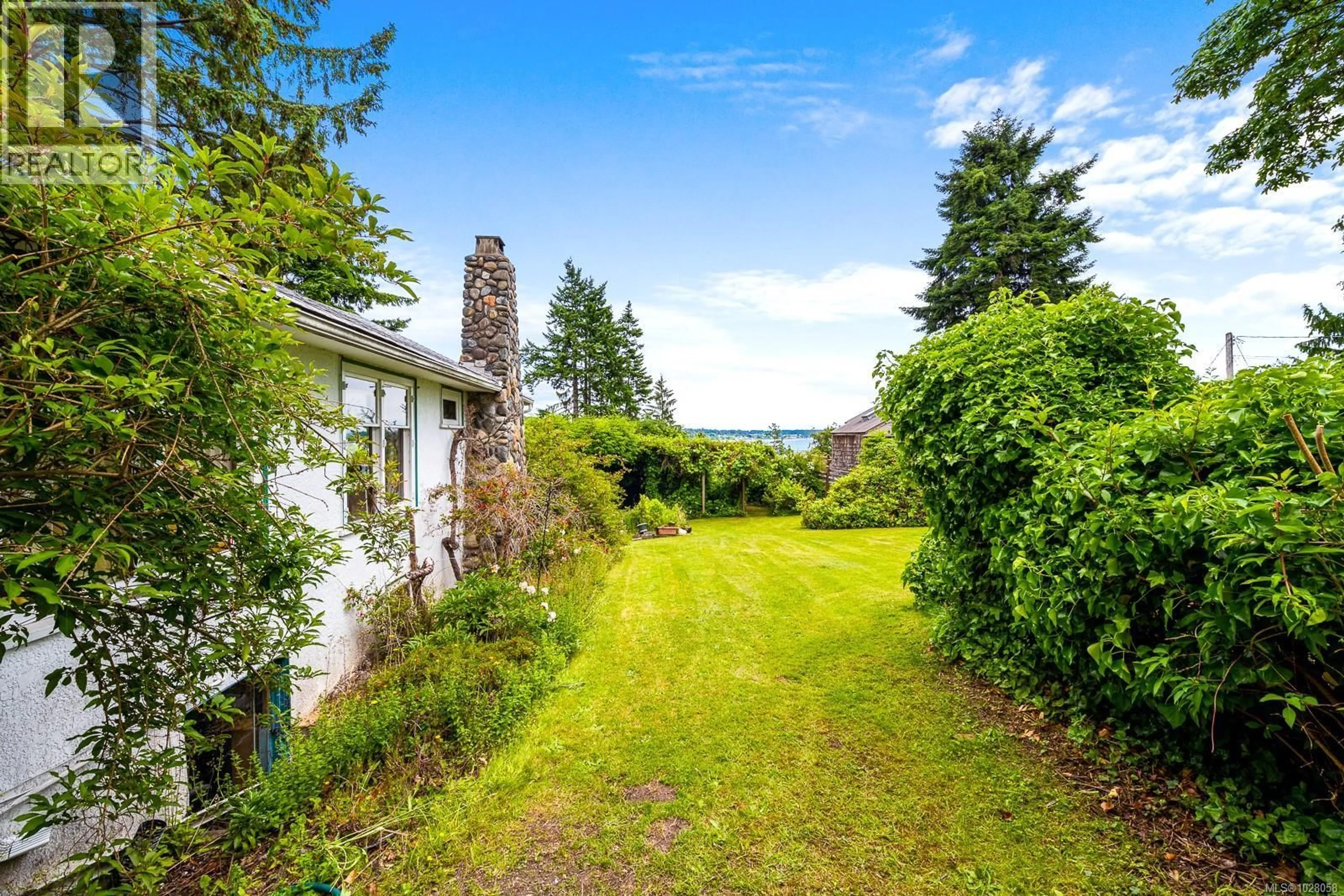 A pic from outside/outdoor area/front of a property/back of a property/a pic from drone, water/lake/river/ocean view for 3508 ISLAND HIGHWAY SOUTH, Courtenay British Columbia V9N9T9