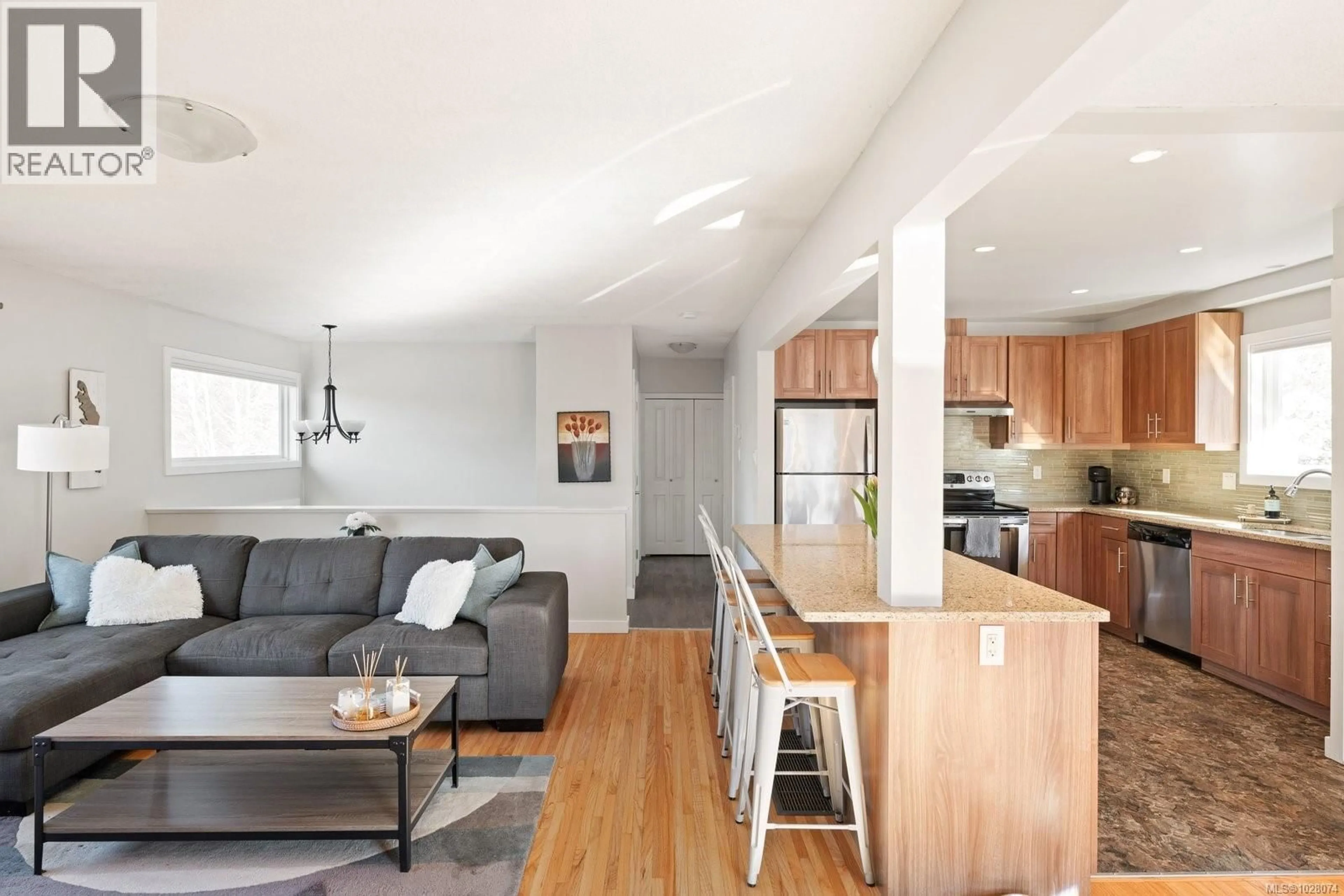 Open concept kitchen, wood/laminate floor for 4125 DOUGLAS STREET, Saanich British Columbia V8X0A5