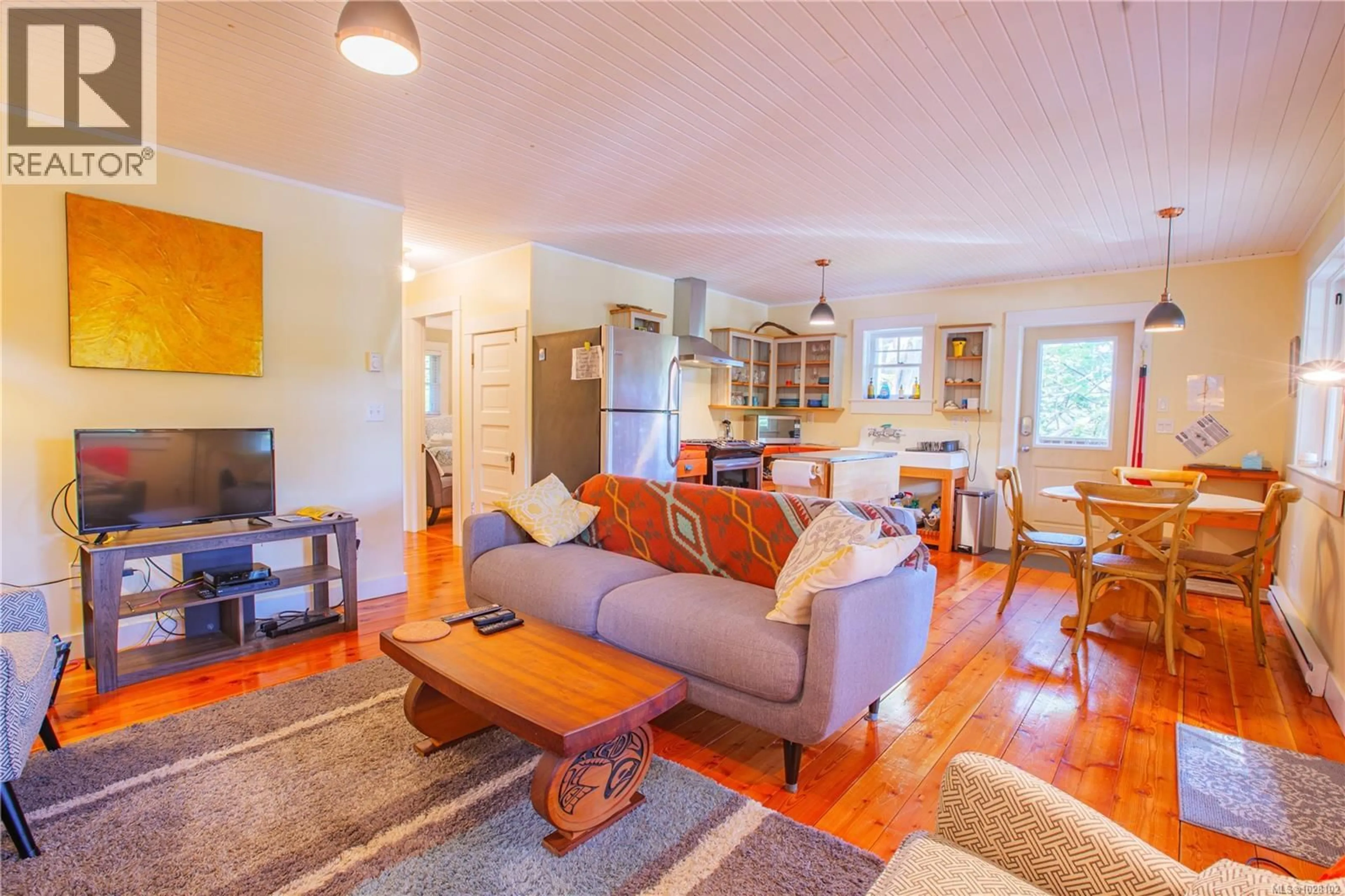 Living room with furniture, wood/laminate floor for 225 BOARDWALK BOULEVARD, Ucluelet British Columbia V0R3A0