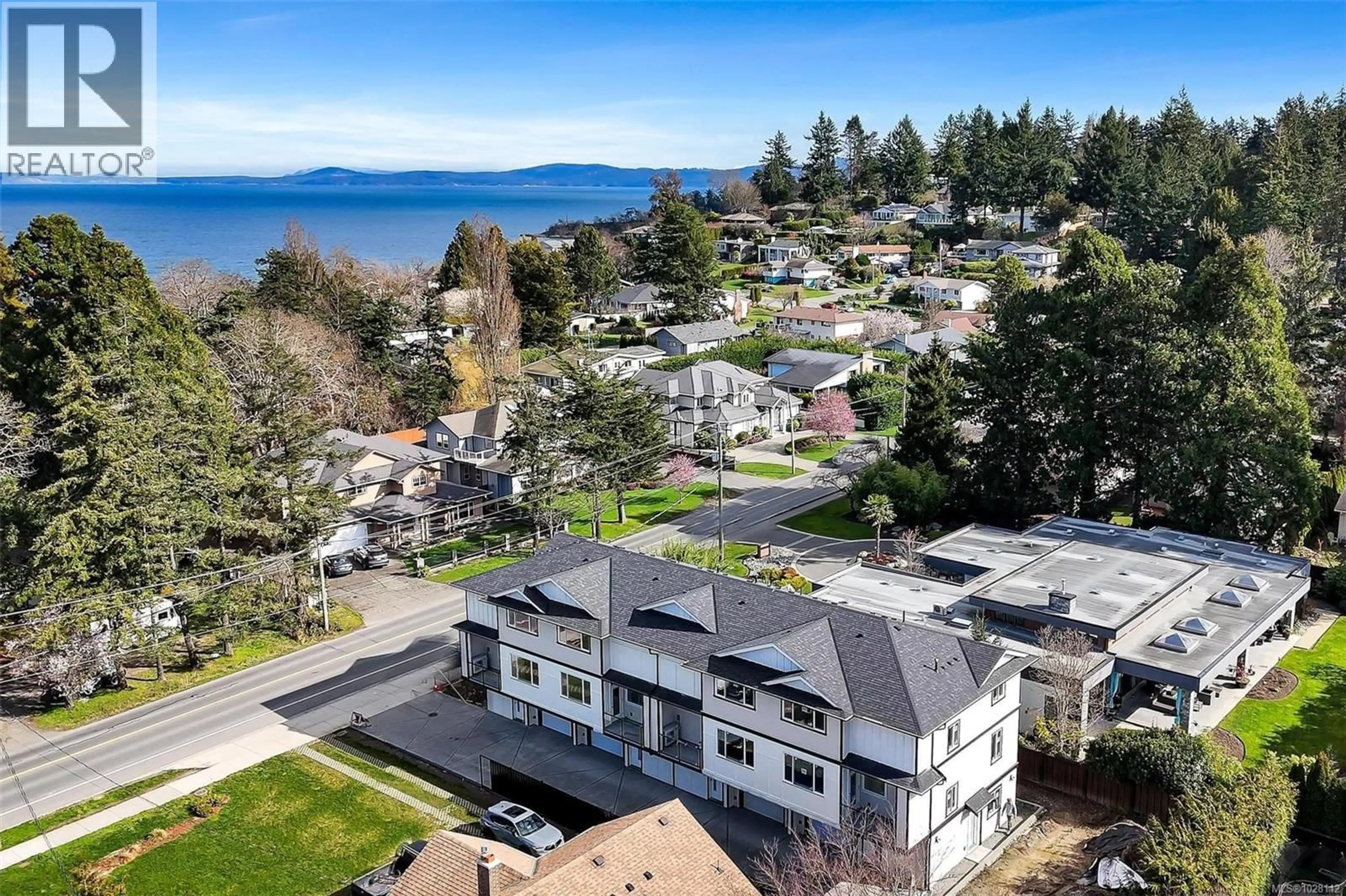 A pic from outside/outdoor area/front of a property/back of a property/a pic from drone, water/lake/river/ocean view for 4 - 1559 ASH ROAD, Saanich British Columbia V8N2S9