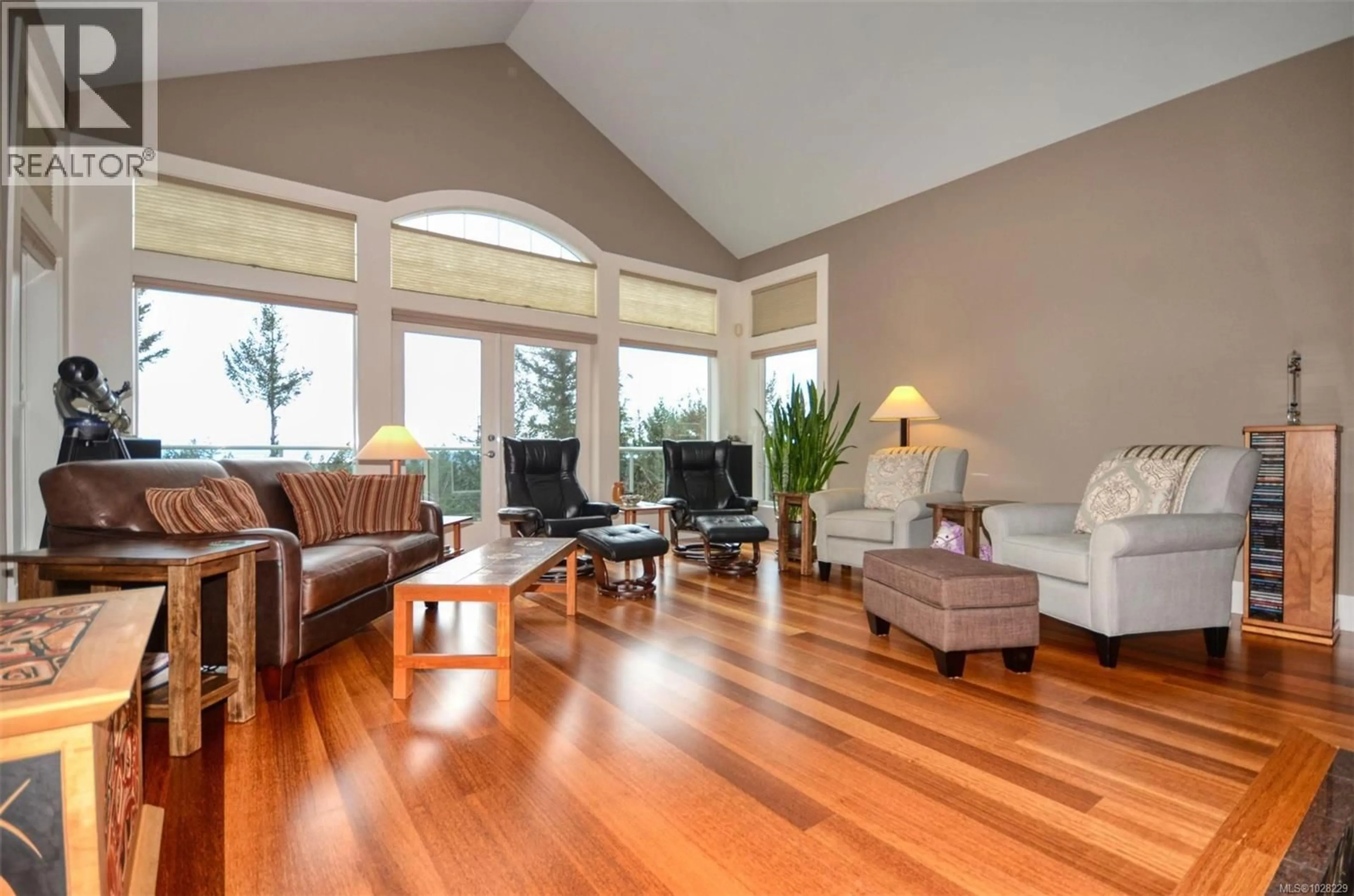 Living room with furniture, wood/laminate floor for 4935 DEER PARK TRAIL, Metchosin British Columbia V9C4J5
