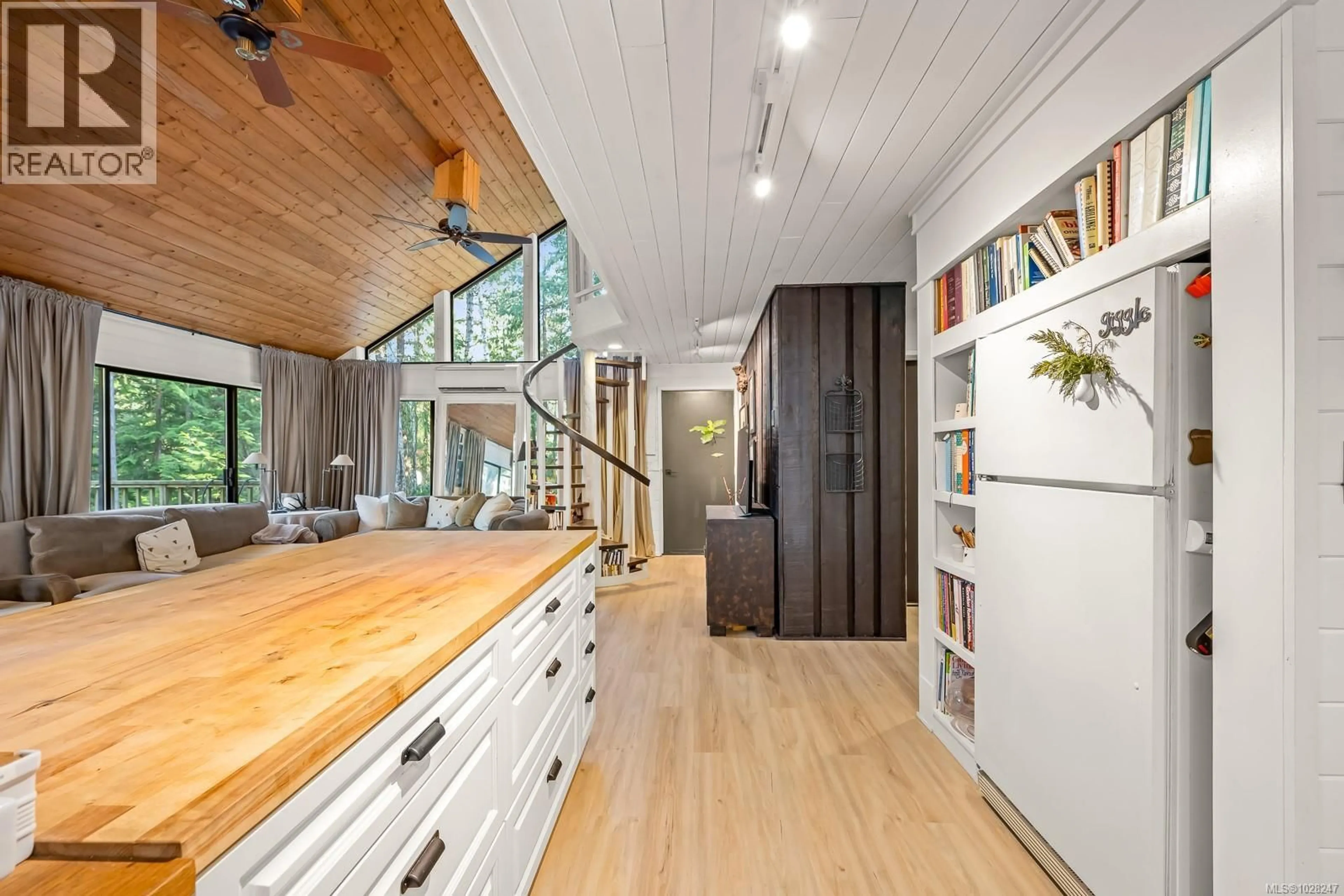 Open concept kitchen, wood/laminate floor for 3480 BRIGANTINE CRESCENT, Hornby Island British Columbia V0R1Z0
