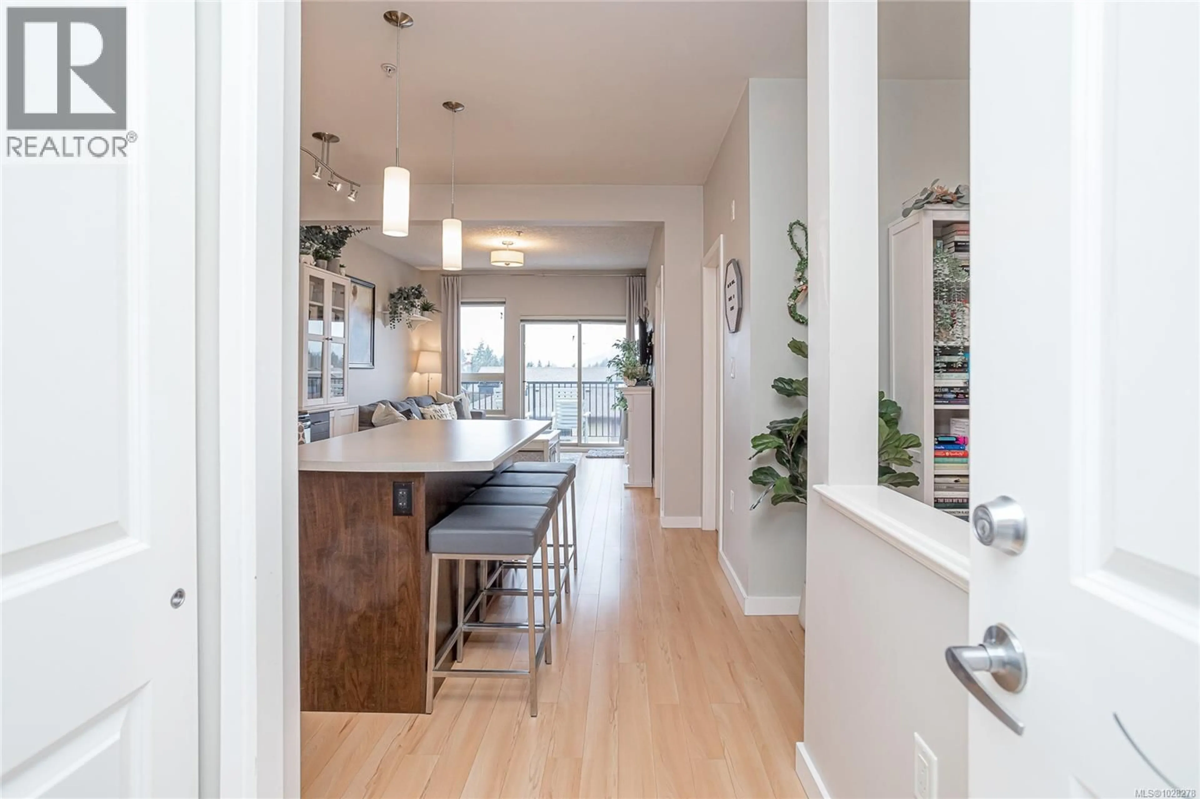 Open concept kitchen, wood/laminate floor for 402 - 3240 JACKLIN ROAD, Langford British Columbia V9C3T6