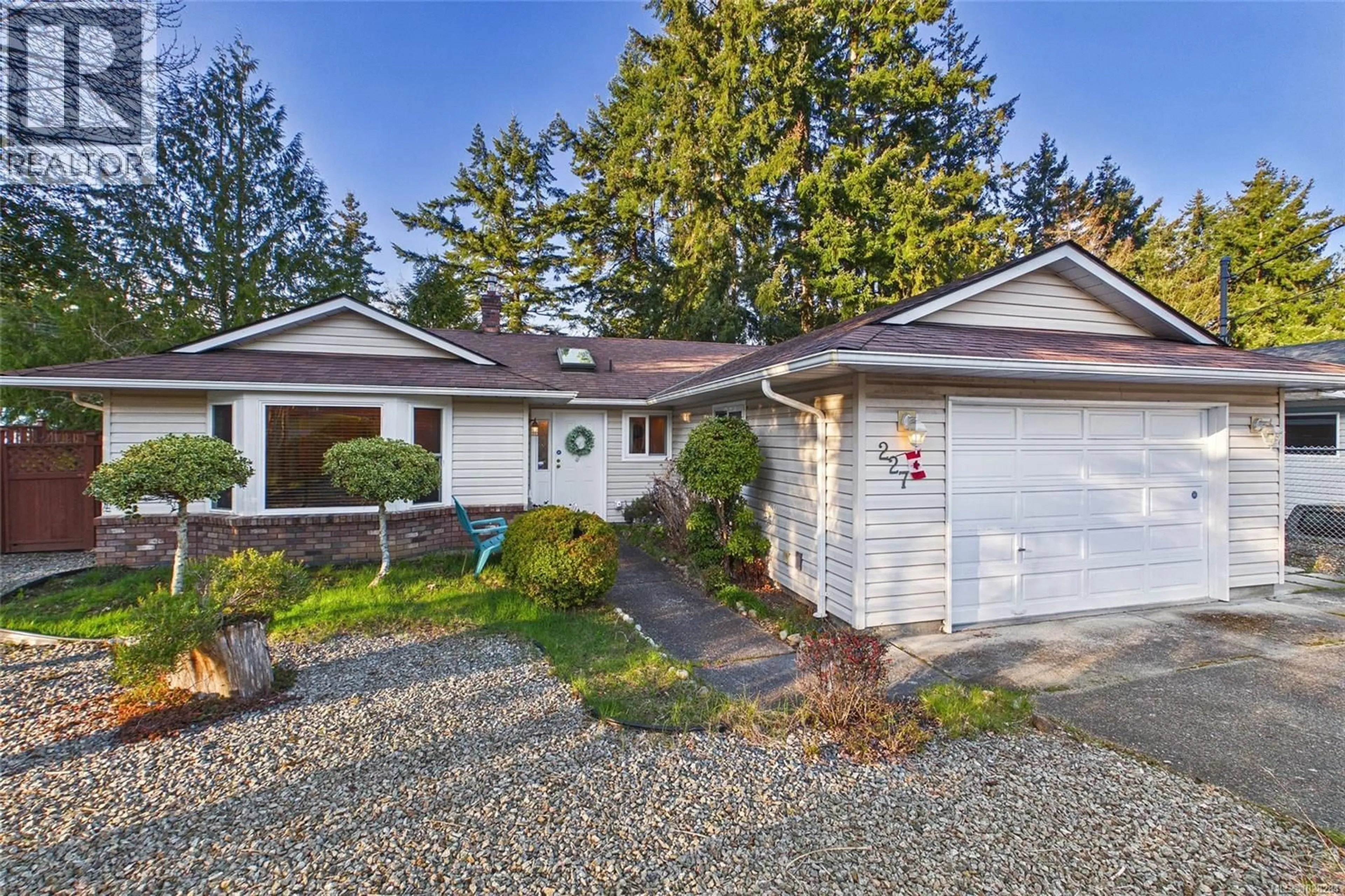Home with vinyl exterior material, street for 227 THETIS AVENUE, Qualicum Beach British Columbia V9K1R8