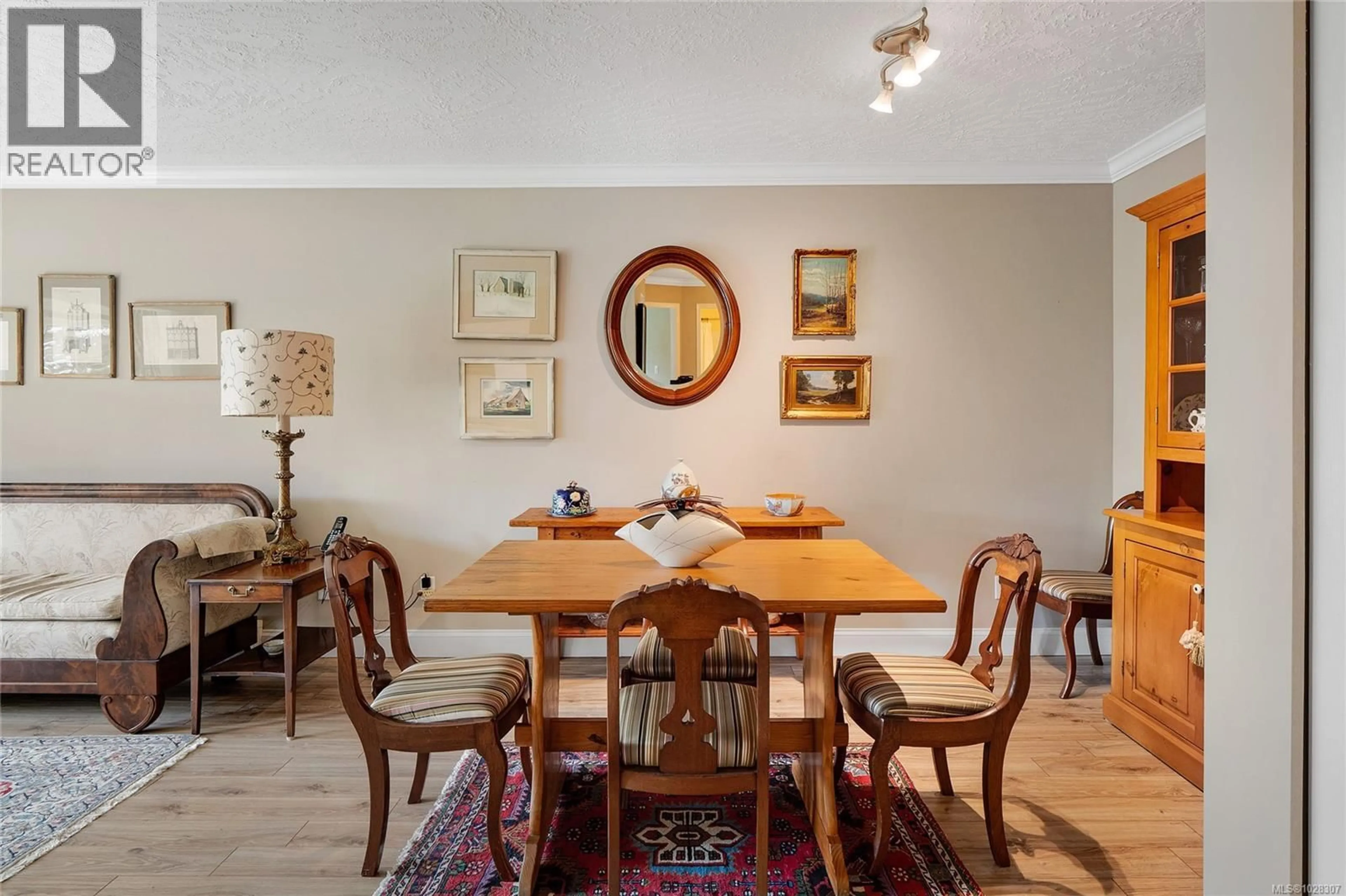 Dining room, wood/laminate floor for 105 - 1505 CHURCH AVENUE, Saanich British Columbia V8P2G7