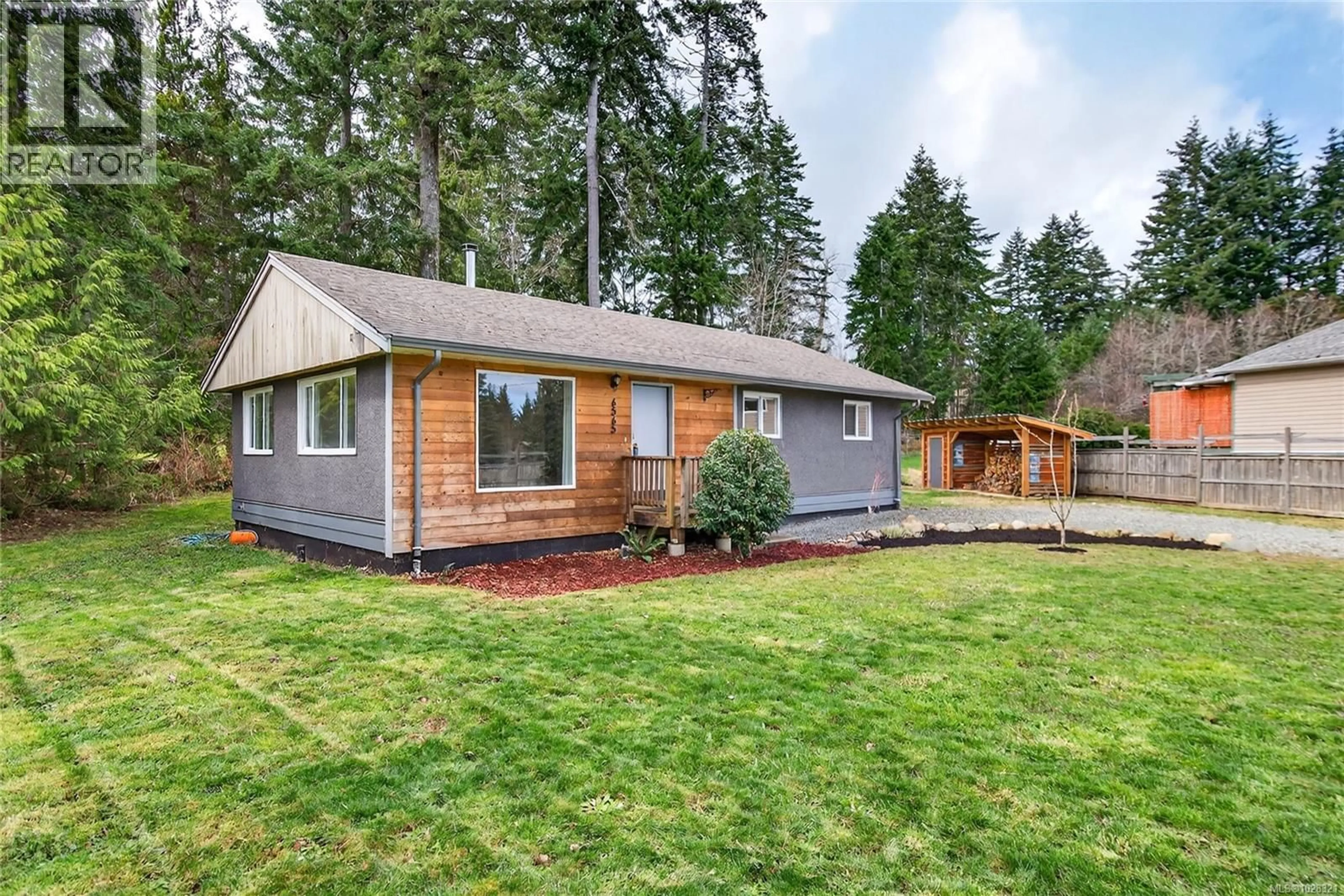 Home with vinyl exterior material, street for 6565 MYSTERY BEACH ROAD, Fanny Bay British Columbia V0R1W0