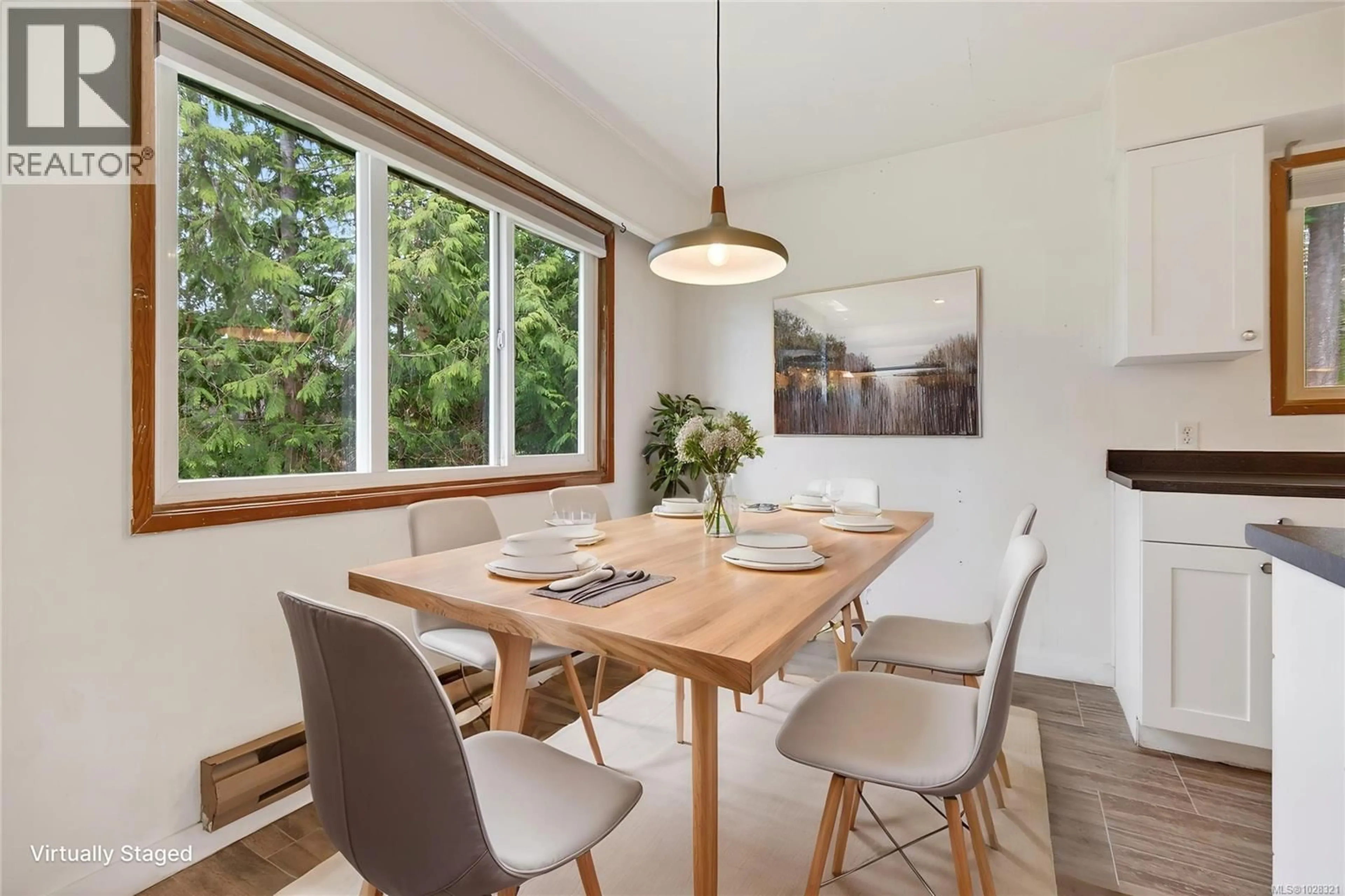 Dining room, wood/laminate floor for 6565 MYSTERY BEACH ROAD, Fanny Bay British Columbia V0R1W0