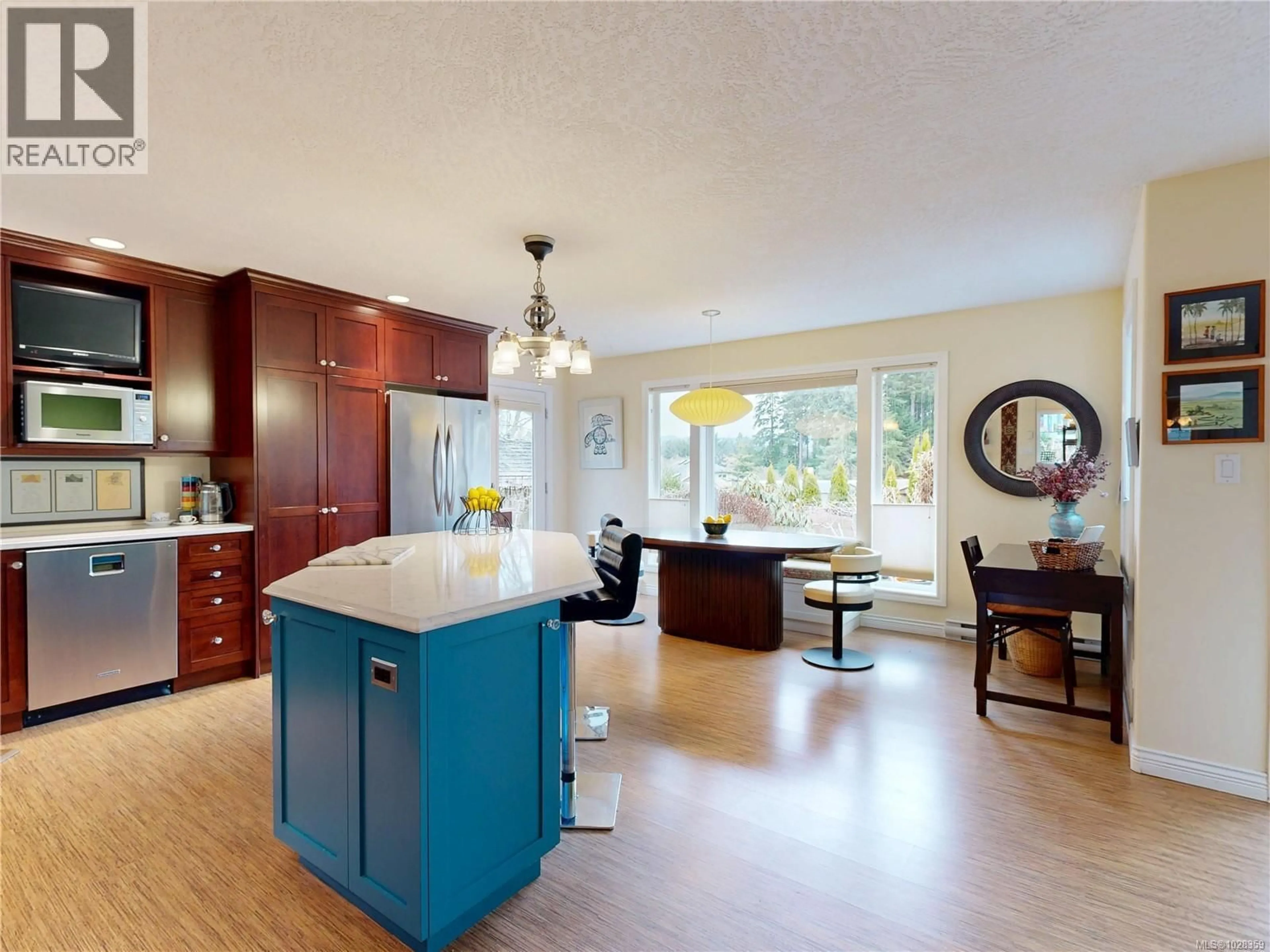 Open concept kitchen, wood/laminate floor for 1607 MARSHALLS PLACE, Sooke British Columbia V9Z0T1