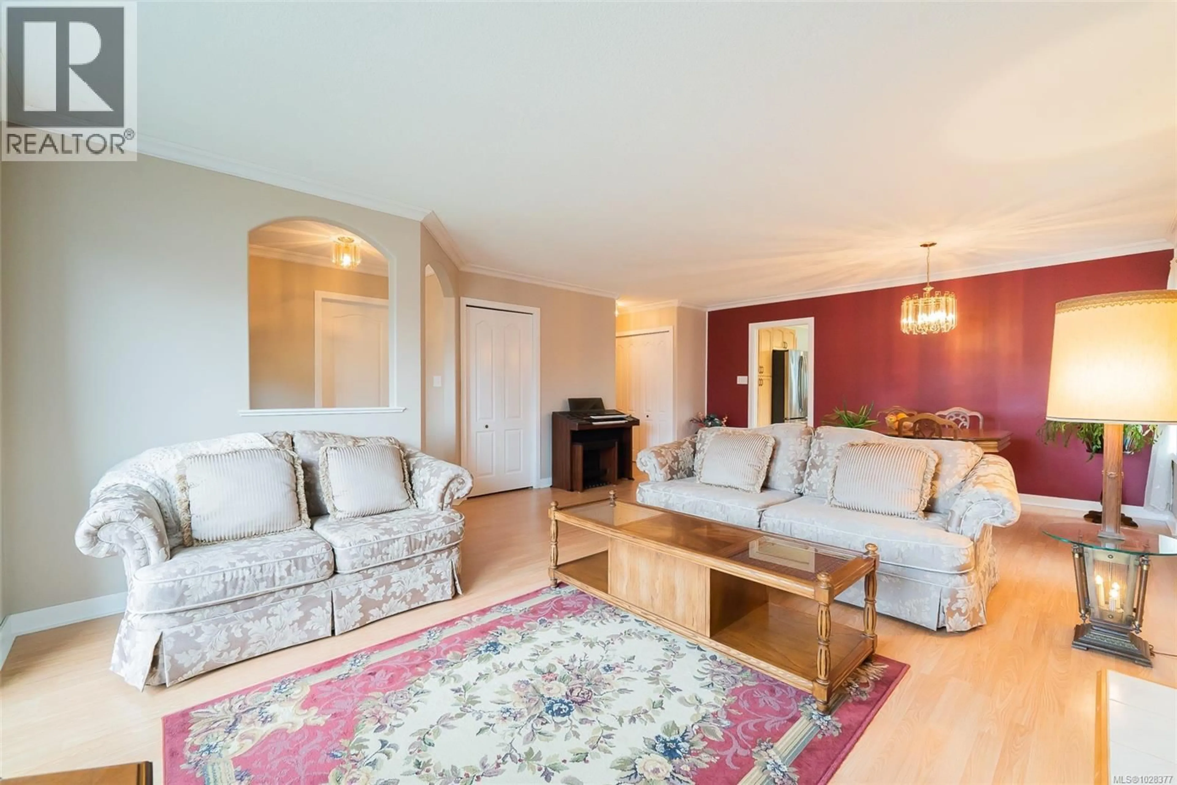 Living room with furniture, wood/laminate floor for 5962 MONASHEE WAY, Nanaimo British Columbia V9T6A2