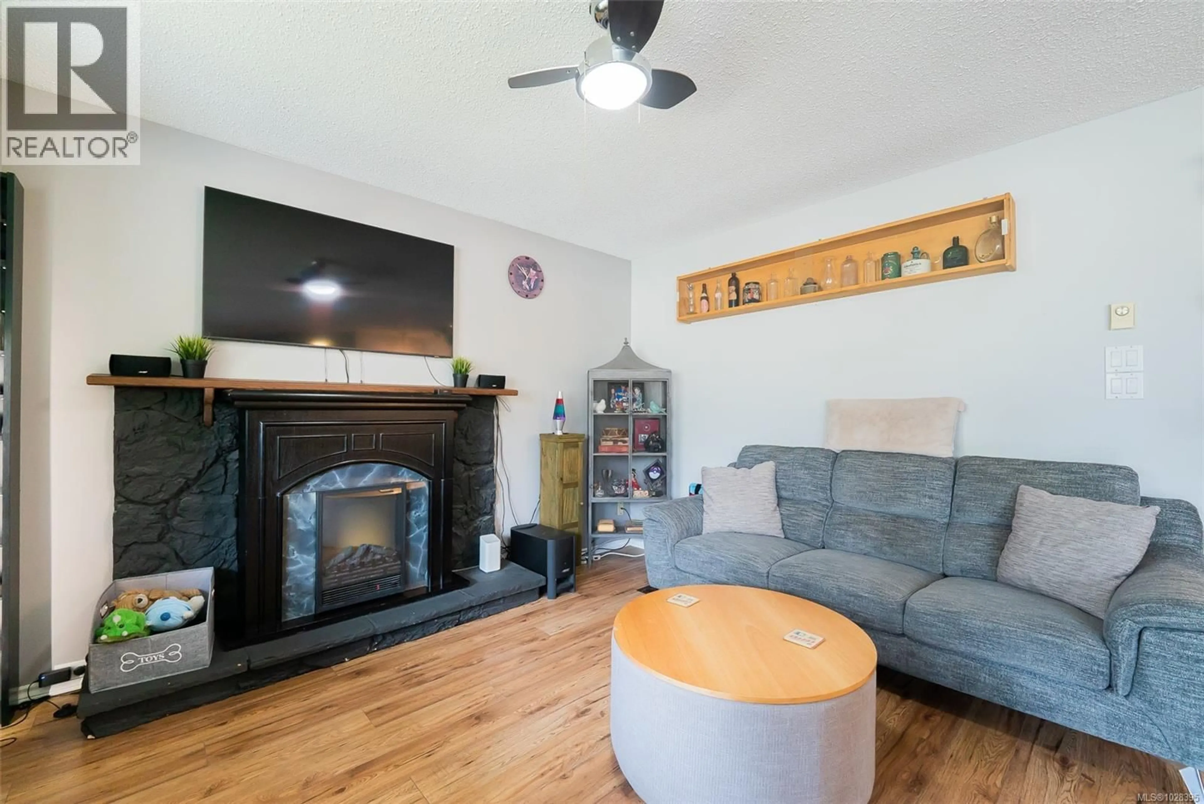 Living room with furniture, wood/laminate floor for 2533 LABIEUX ROAD, Nanaimo British Columbia V9T3M8