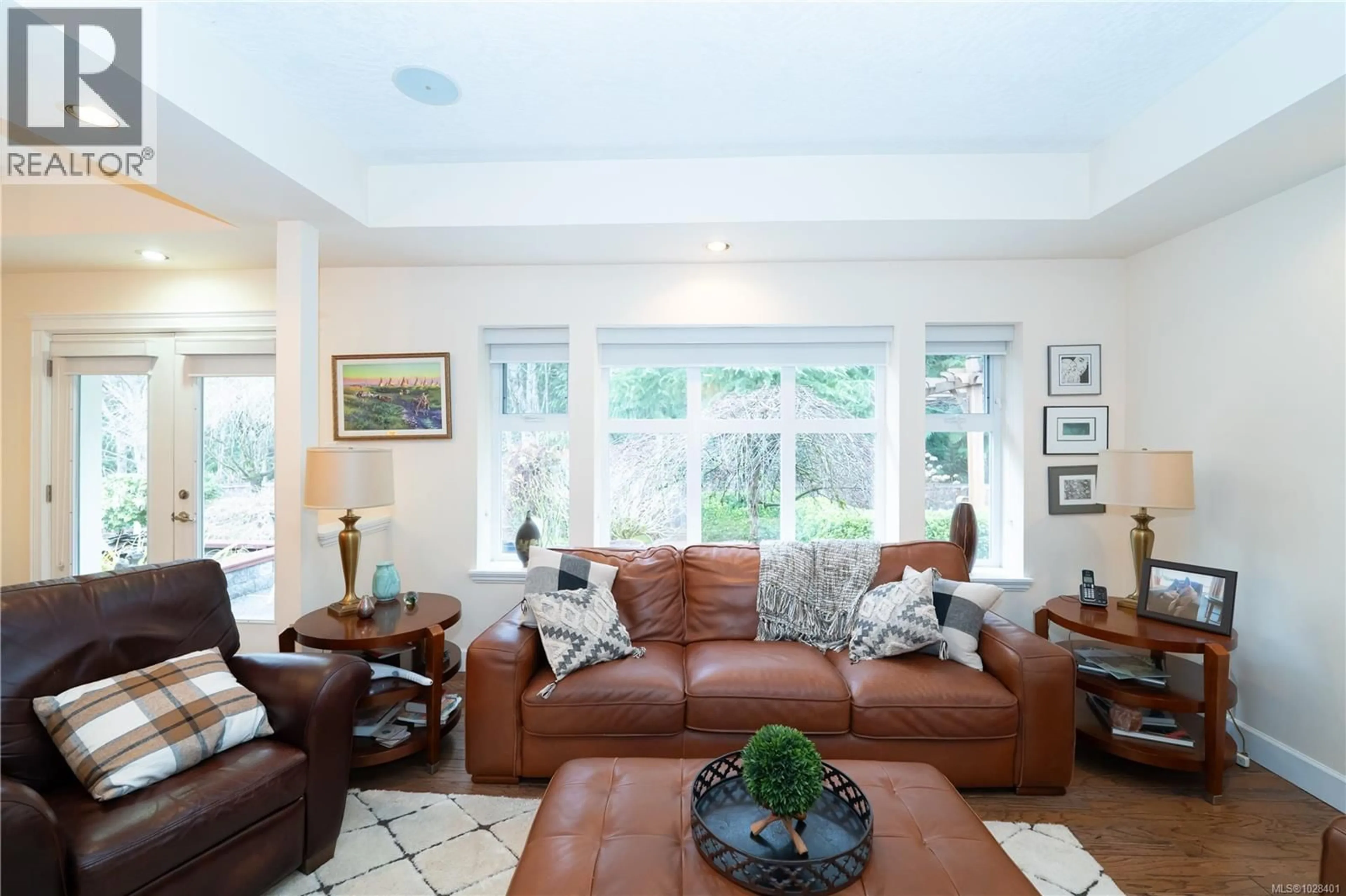 Living room with furniture, ceramic/tile floor for 2514 KINNOULL CRESCENT, Mill Bay British Columbia V8H1H3