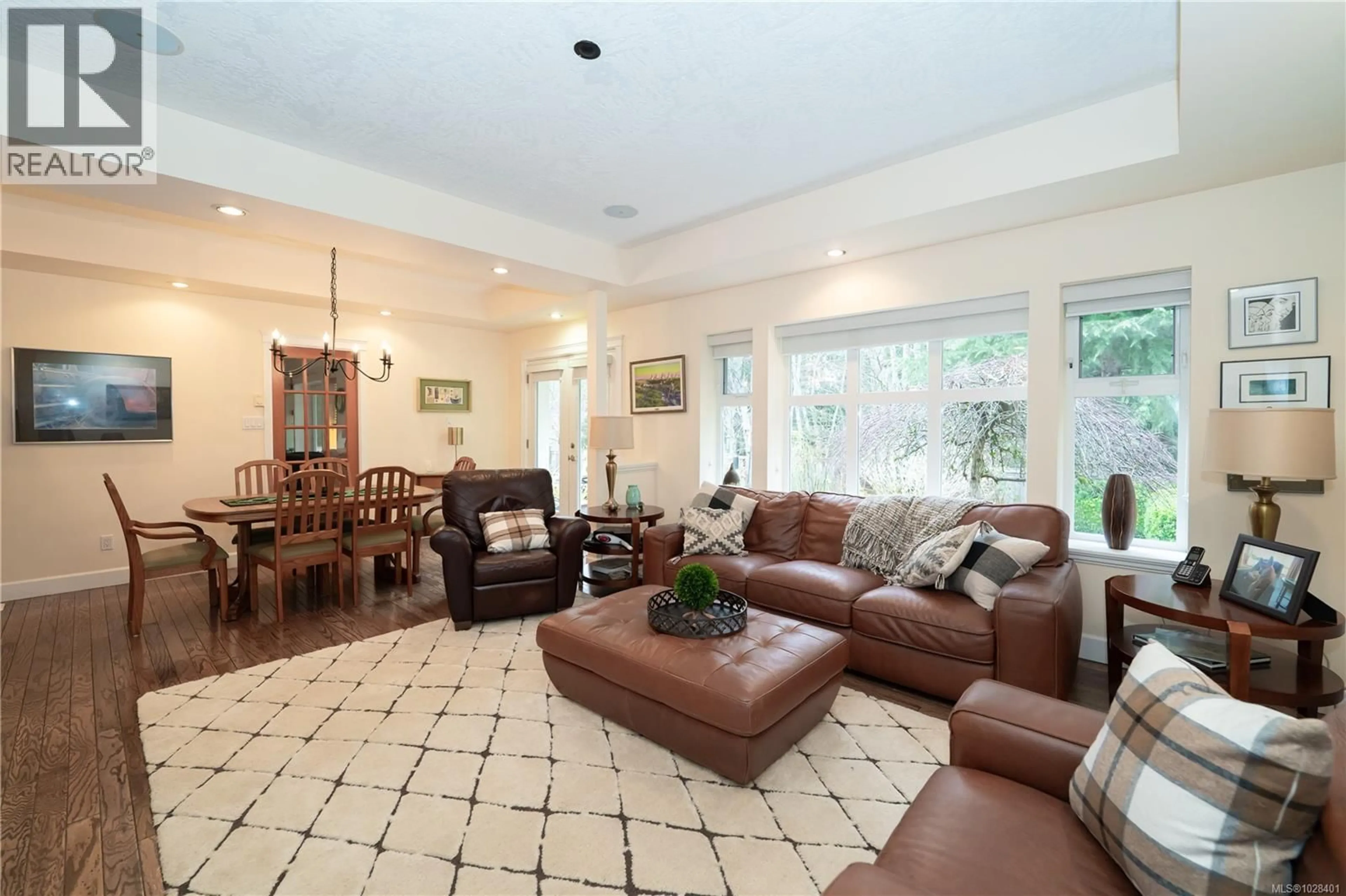 Living room with furniture, ceramic/tile floor for 2514 KINNOULL CRESCENT, Mill Bay British Columbia V8H1H3