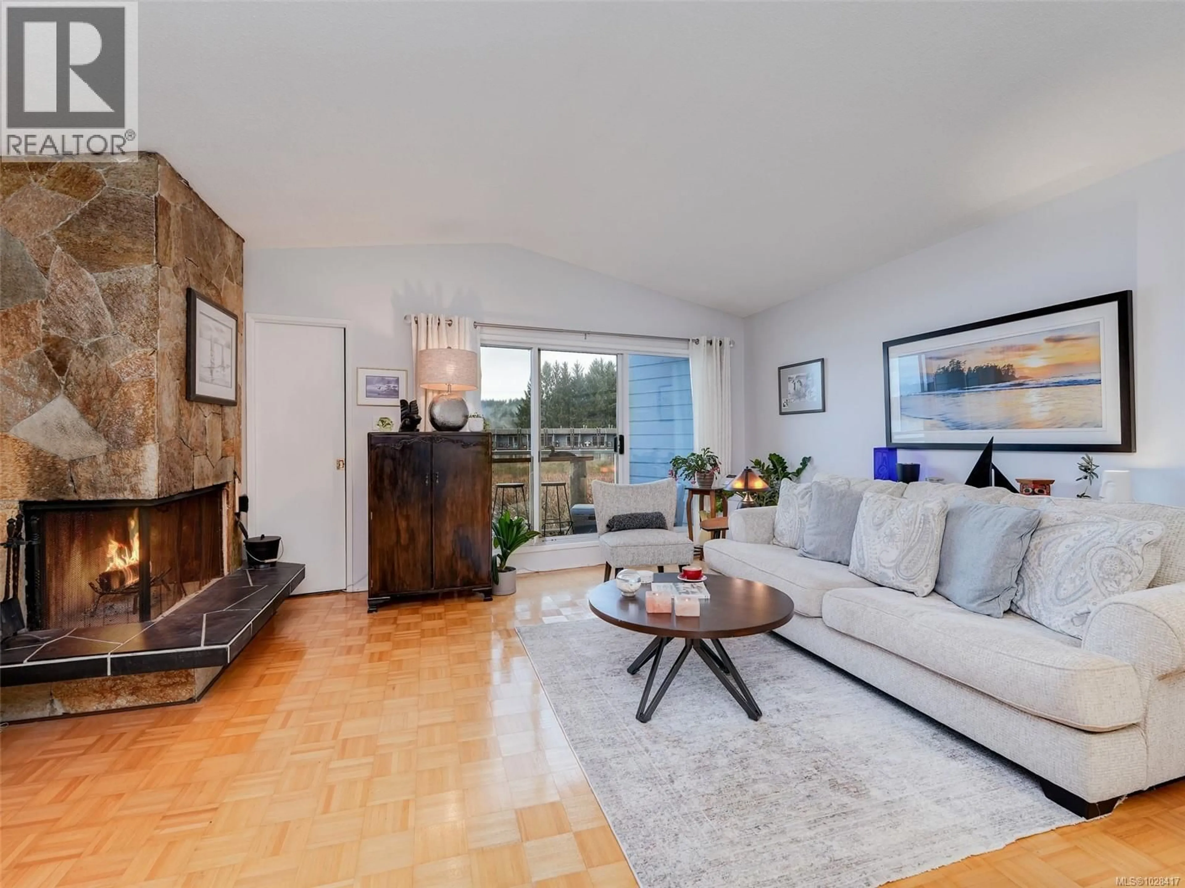 Living room with furniture, wood/laminate floor for 15 - 6110 SEABROOM ROAD, Sooke British Columbia V9Z0B8