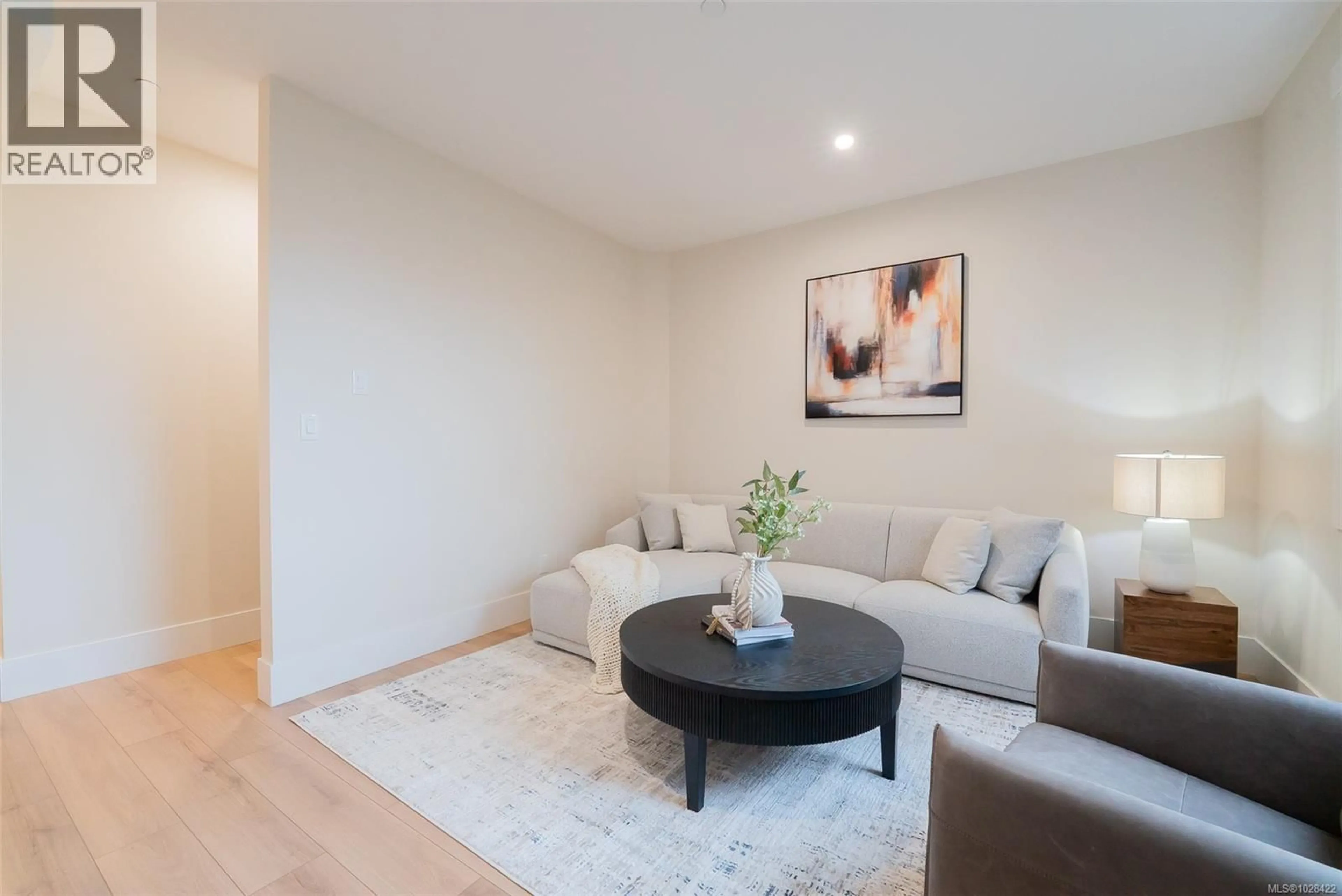 Living room with furniture, wood/laminate floor for 111 - 1615 NORTHFIELD ROAD, Nanaimo British Columbia V9S5A8