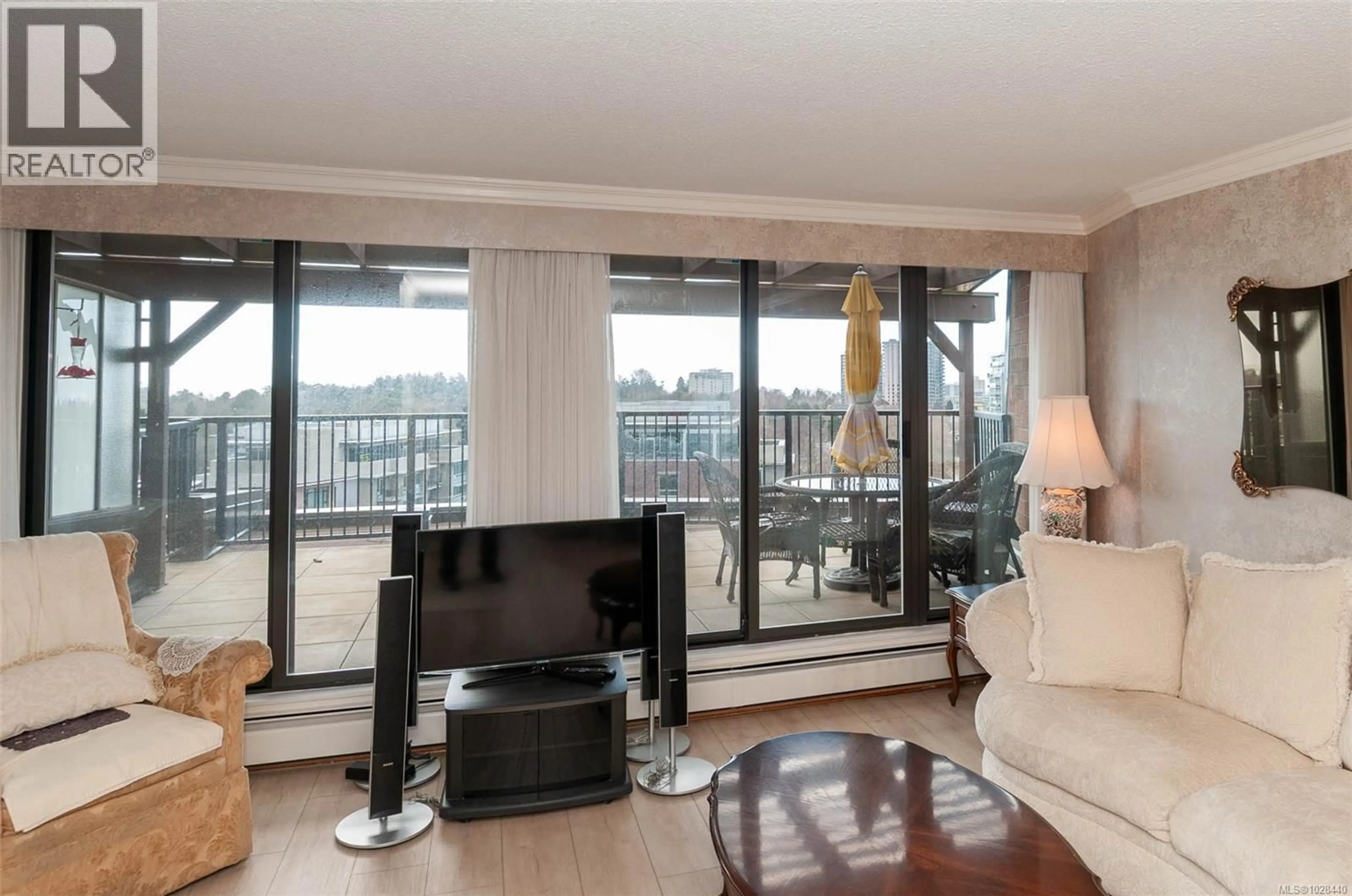 Living room with furniture, wood/laminate floor for 901 - 777 BLANSHARD STREET, Victoria British Columbia V8W2G9
