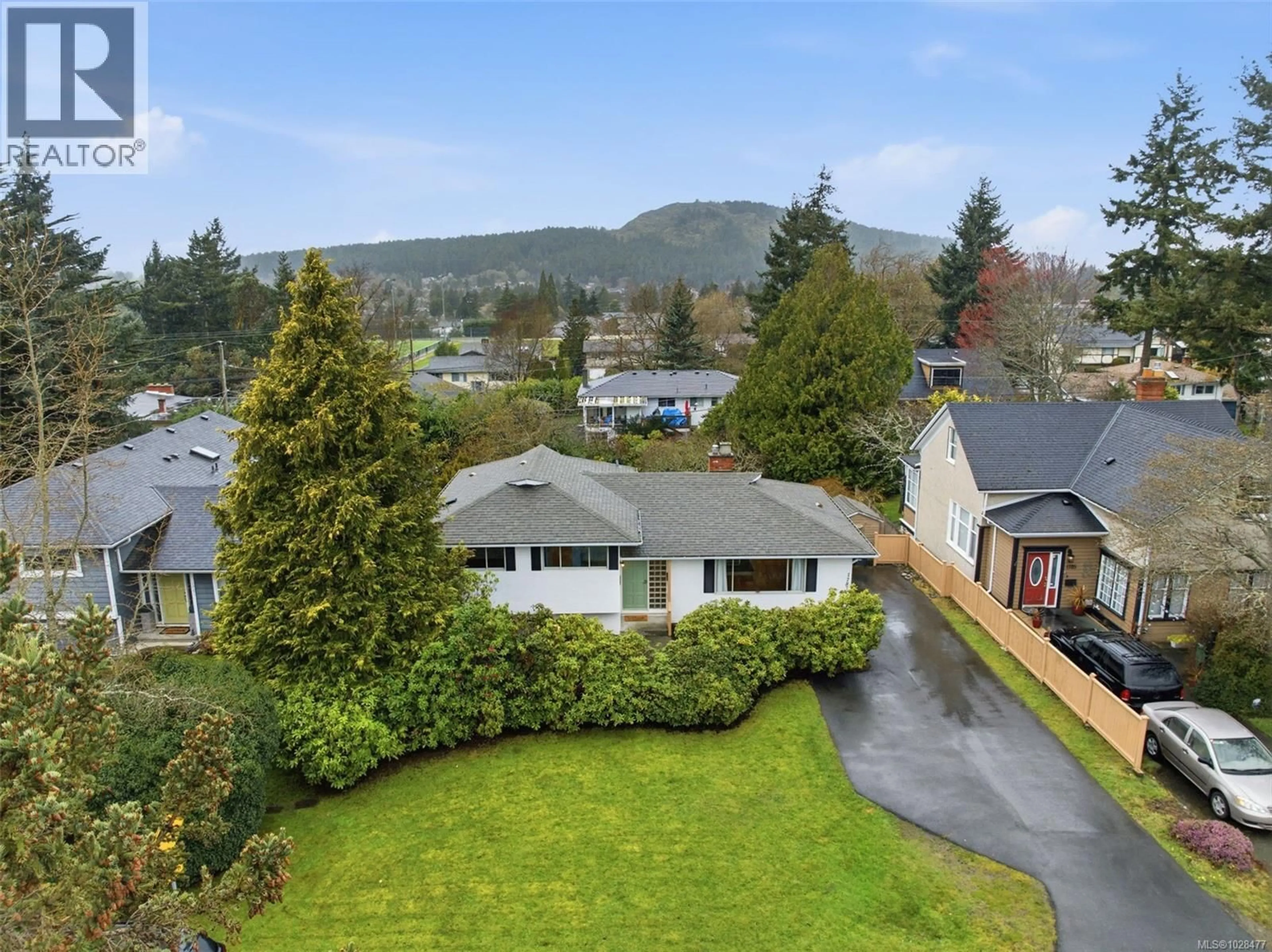 A pic from outside/outdoor area/front of a property/back of a property/a pic from drone, mountain view for 1787 PENSHURST ROAD, Saanich British Columbia V8N2N6