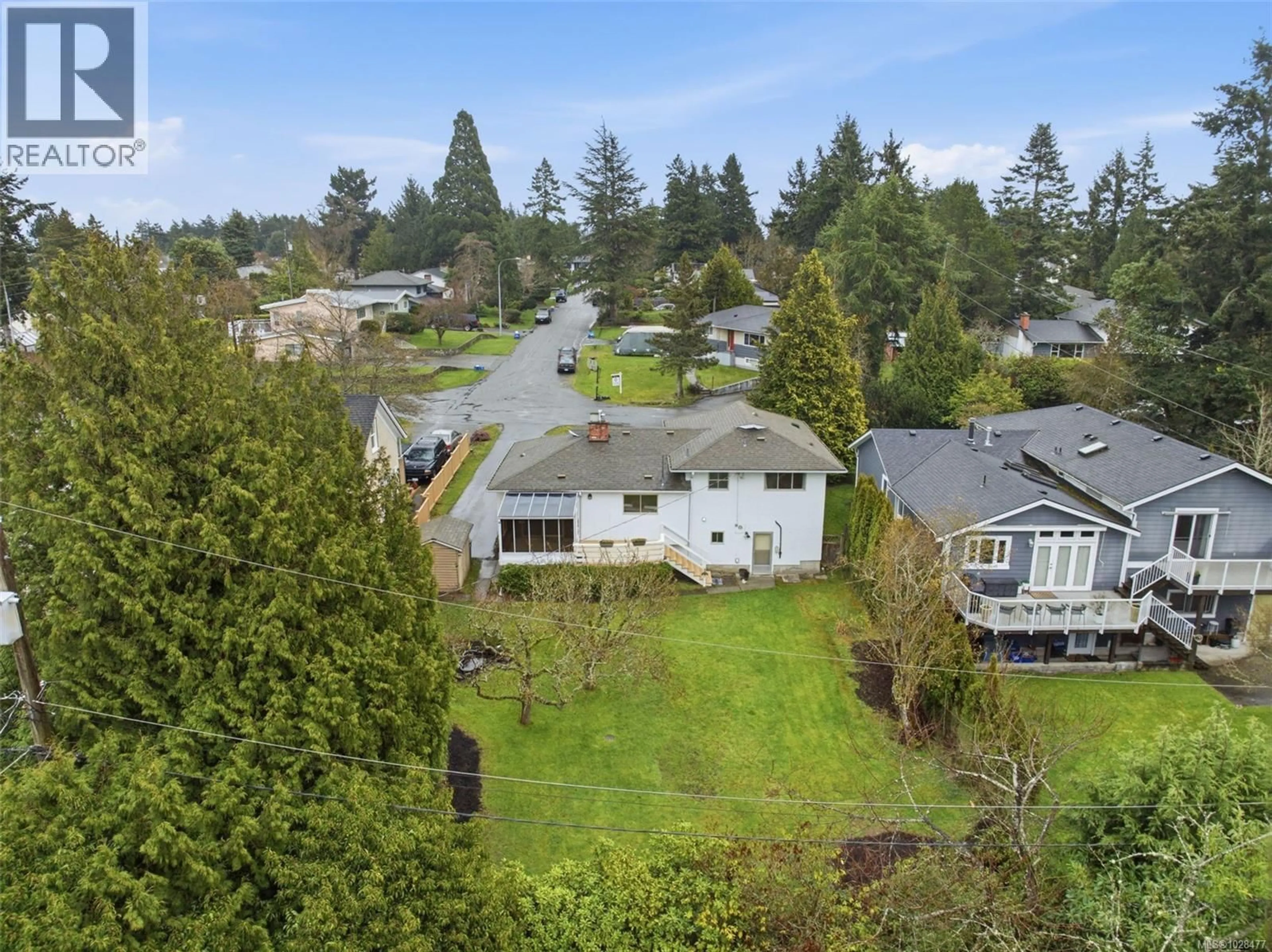 A pic from outside/outdoor area/front of a property/back of a property/a pic from drone, street for 1787 PENSHURST ROAD, Saanich British Columbia V8N2N6