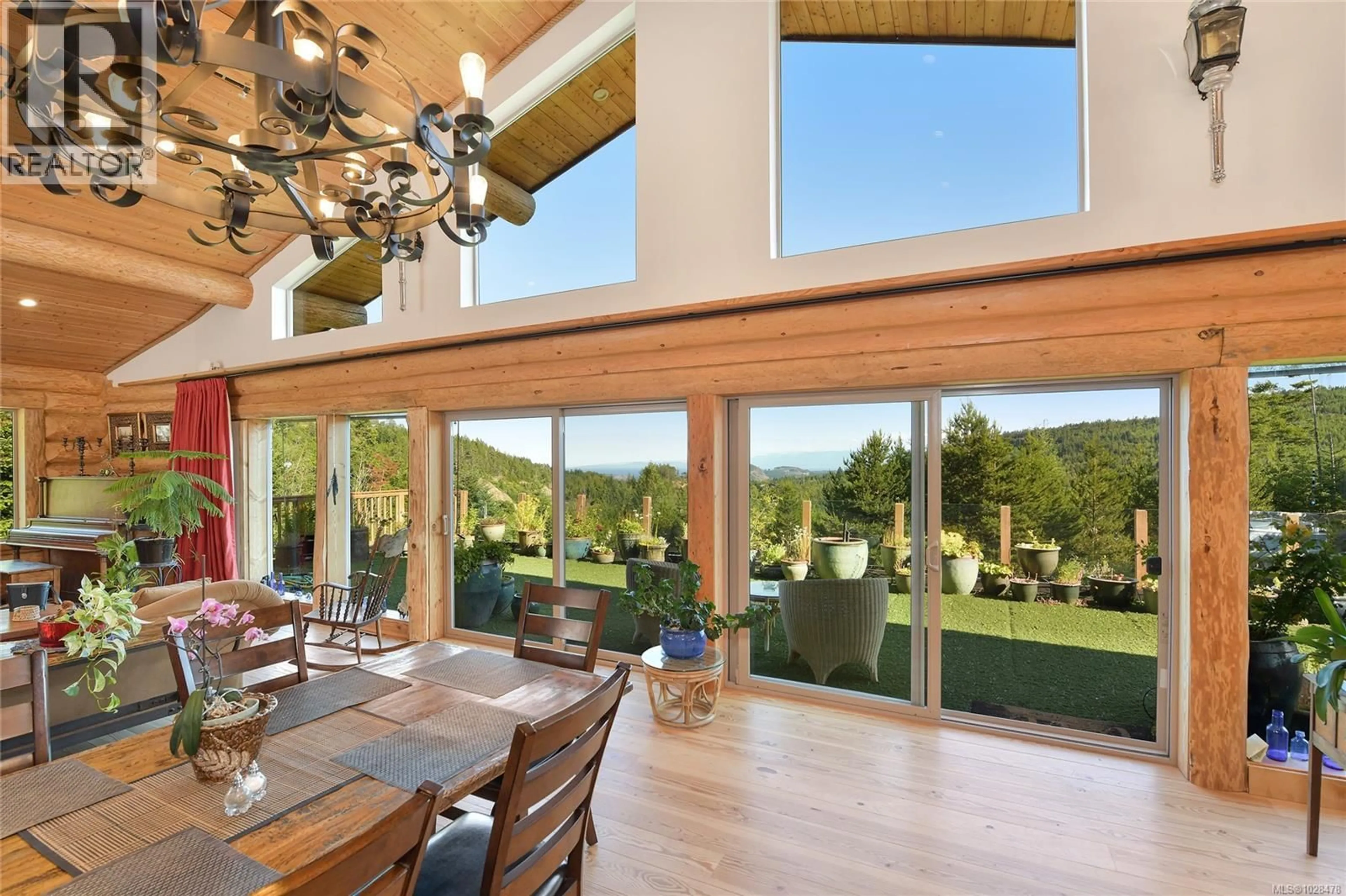Dining room, wood/laminate floor for 4250 GOLDSTREAM HEIGHTS DRIVE, Malahat British Columbia V0R2W3