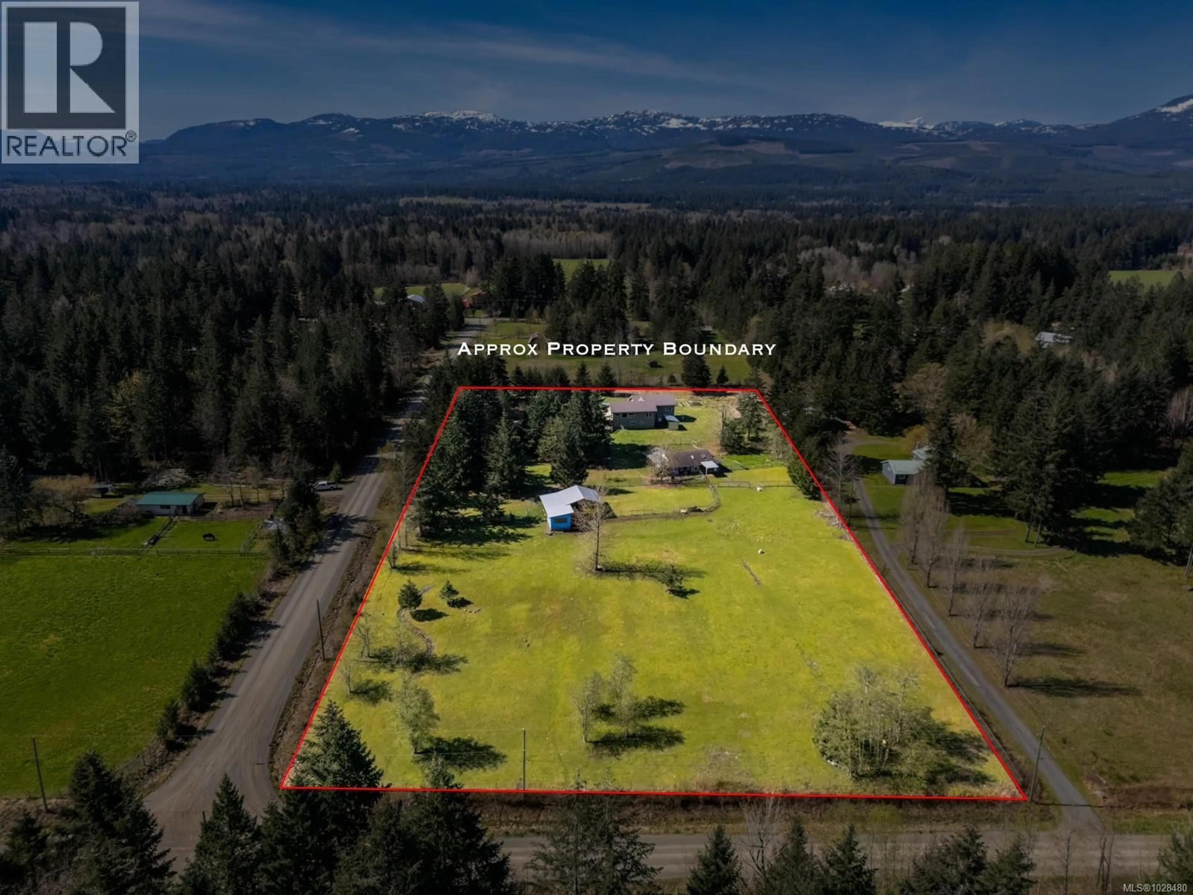 A pic from outside/outdoor area/front of a property/back of a property/a pic from drone, mountain view for 2892 MARIDGE ROAD, Courtenay British Columbia V9J1M9