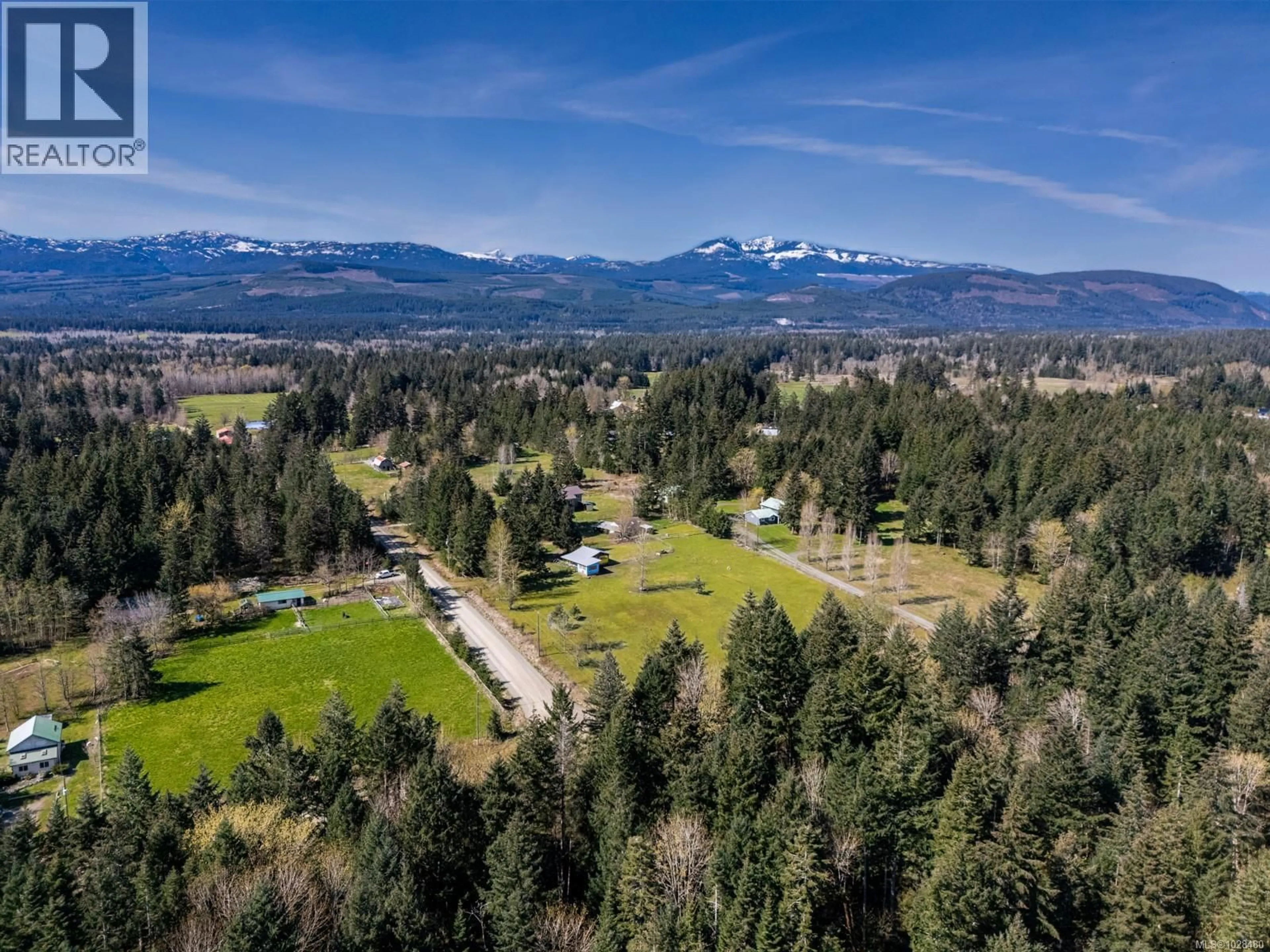 A pic from outside/outdoor area/front of a property/back of a property/a pic from drone, mountain view for 2892 MARIDGE ROAD, Courtenay British Columbia V9J1M9