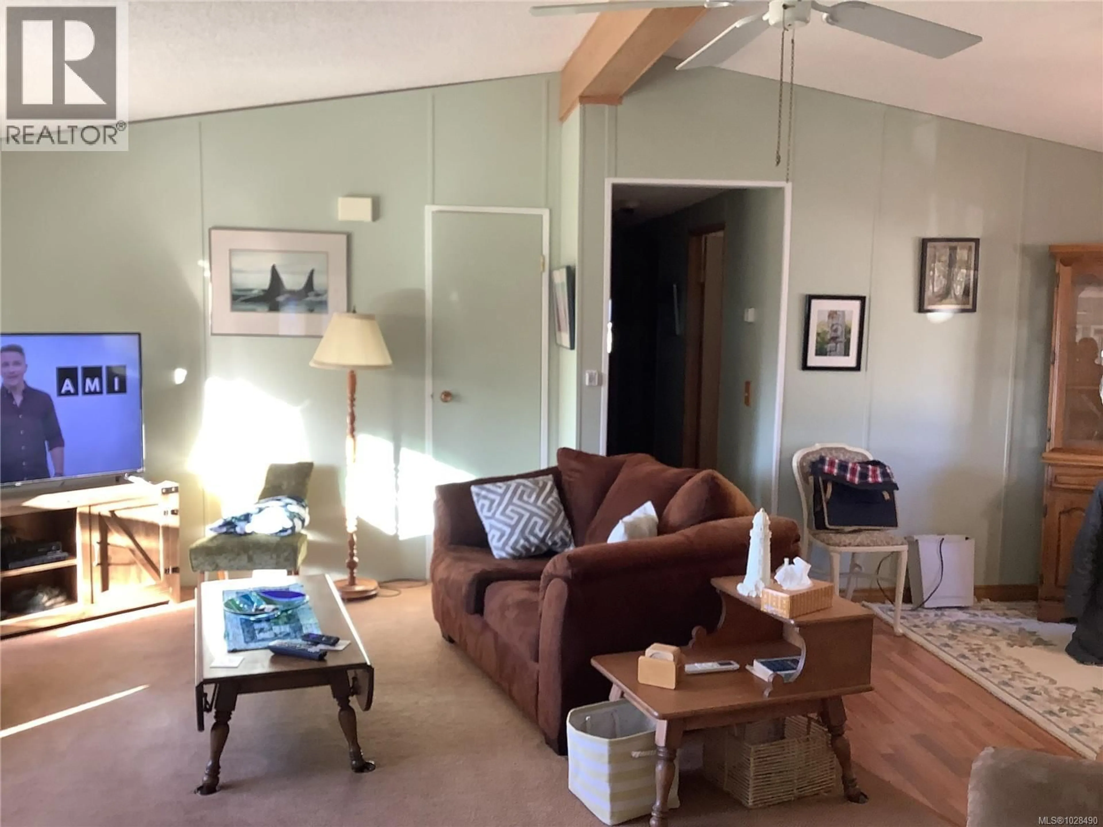 Living room with furniture, wood/laminate floor for 245 3RD STREET, Sointula British Columbia V0N3E0