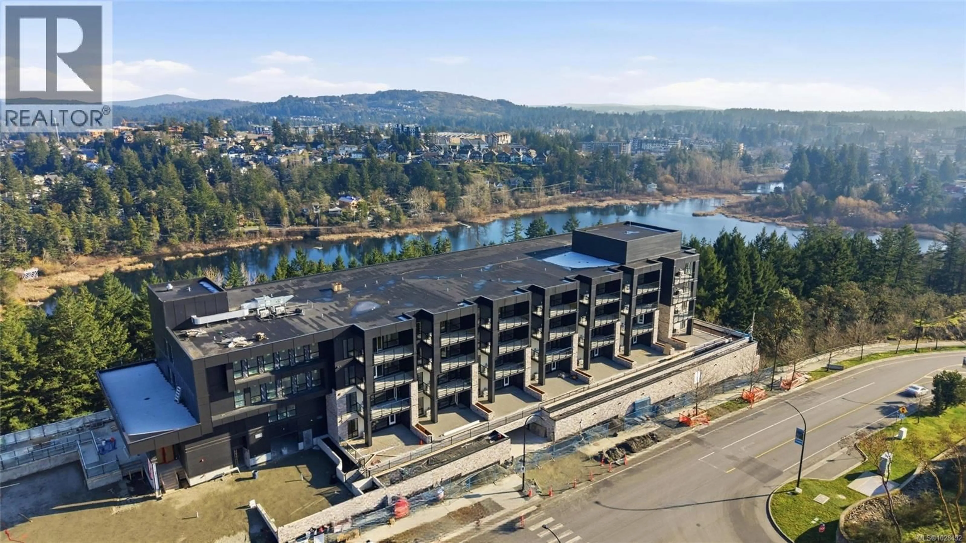 A pic from outside/outdoor area/front of a property/back of a property/a pic from drone, water/lake/river/ocean view for 116 - 2341 BEAR MOUNTAIN PARKWAY, Langford British Columbia V9B6V1